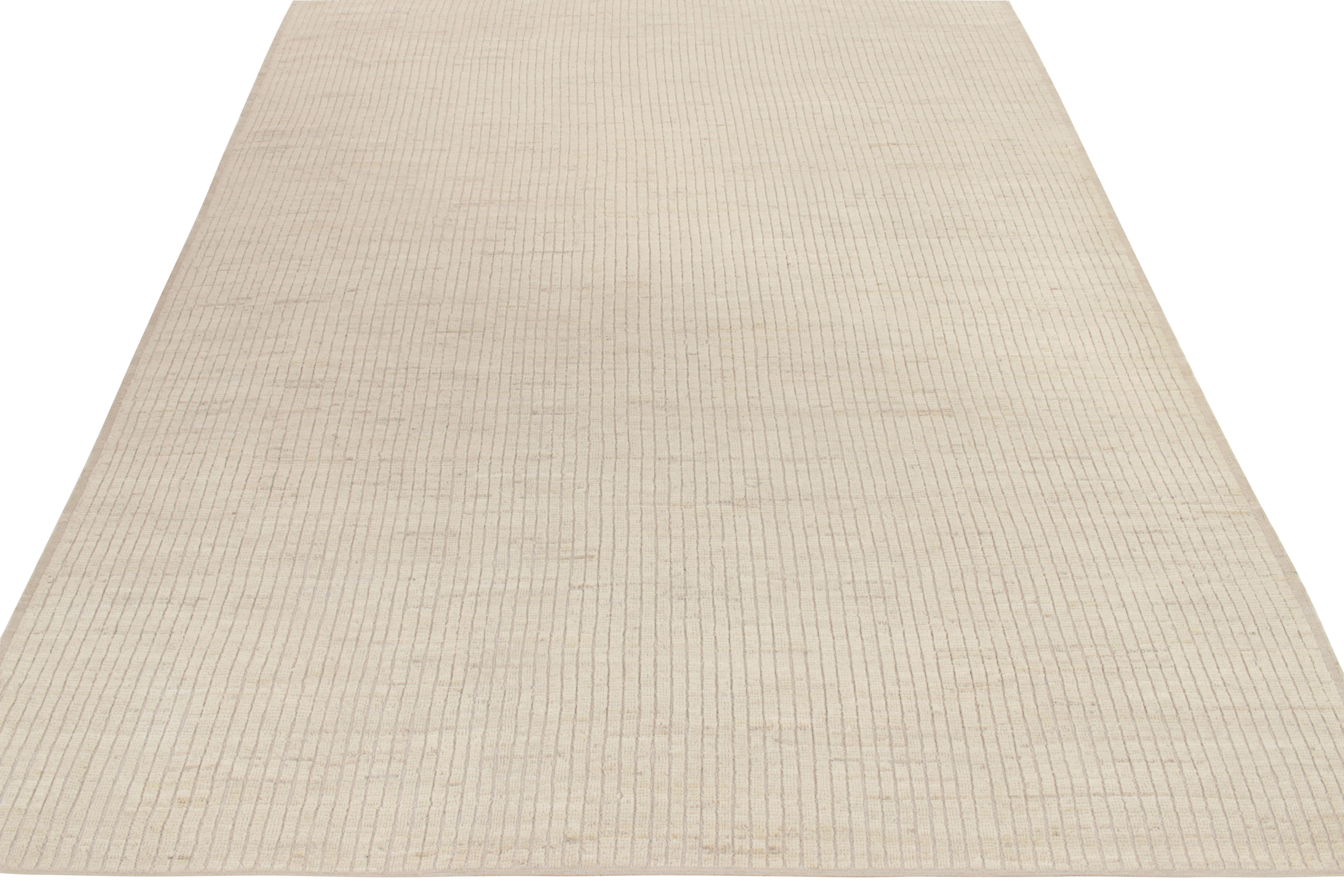 Hand-knotted in wool, a 9 x 12 rug from our New & Modern Collection featuring a union of pile & flatwoven sensibilities, uniquely transitioning as a high low texture relishing subtle colorway gradient in beige and off white tones. Overall a