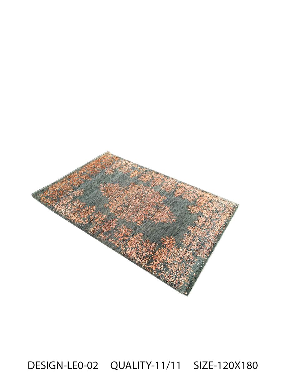 A new addition to the handmade rugs by Rug & Kilim, this 4'1” x 6'1” contemporary rug is hand knotted in a unique, proprietary blend of quality wool and silk, the natural luster of the latter bringing out transitional hues of orange and green with a