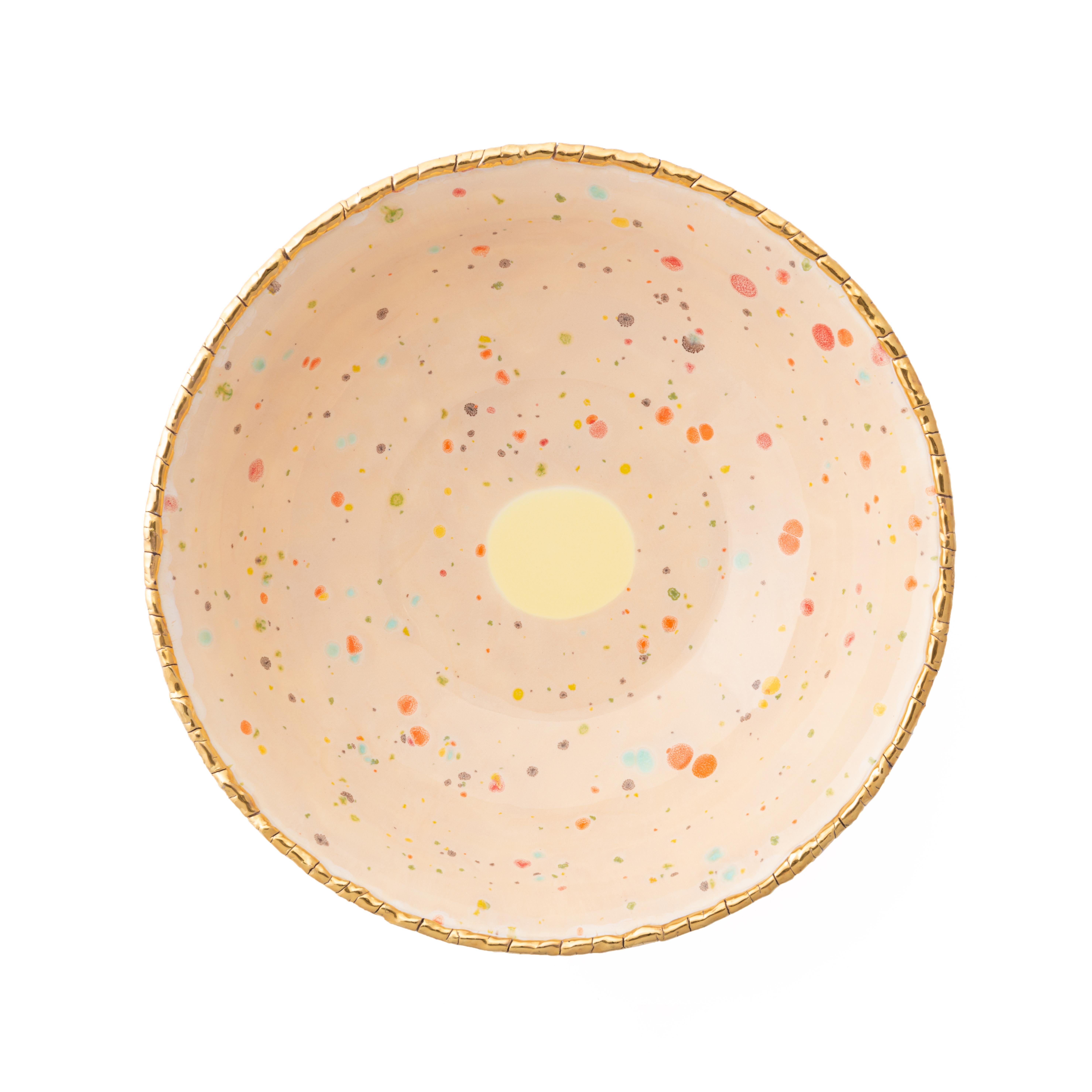 Handcrafted in Italy from the finest porcelain, this blue marble Chestnut salad bowl has an original golden crackled rim emphasizing the warm sandy surface covered with little multicolor dots and the bright yellow splotch at the center.

Salad