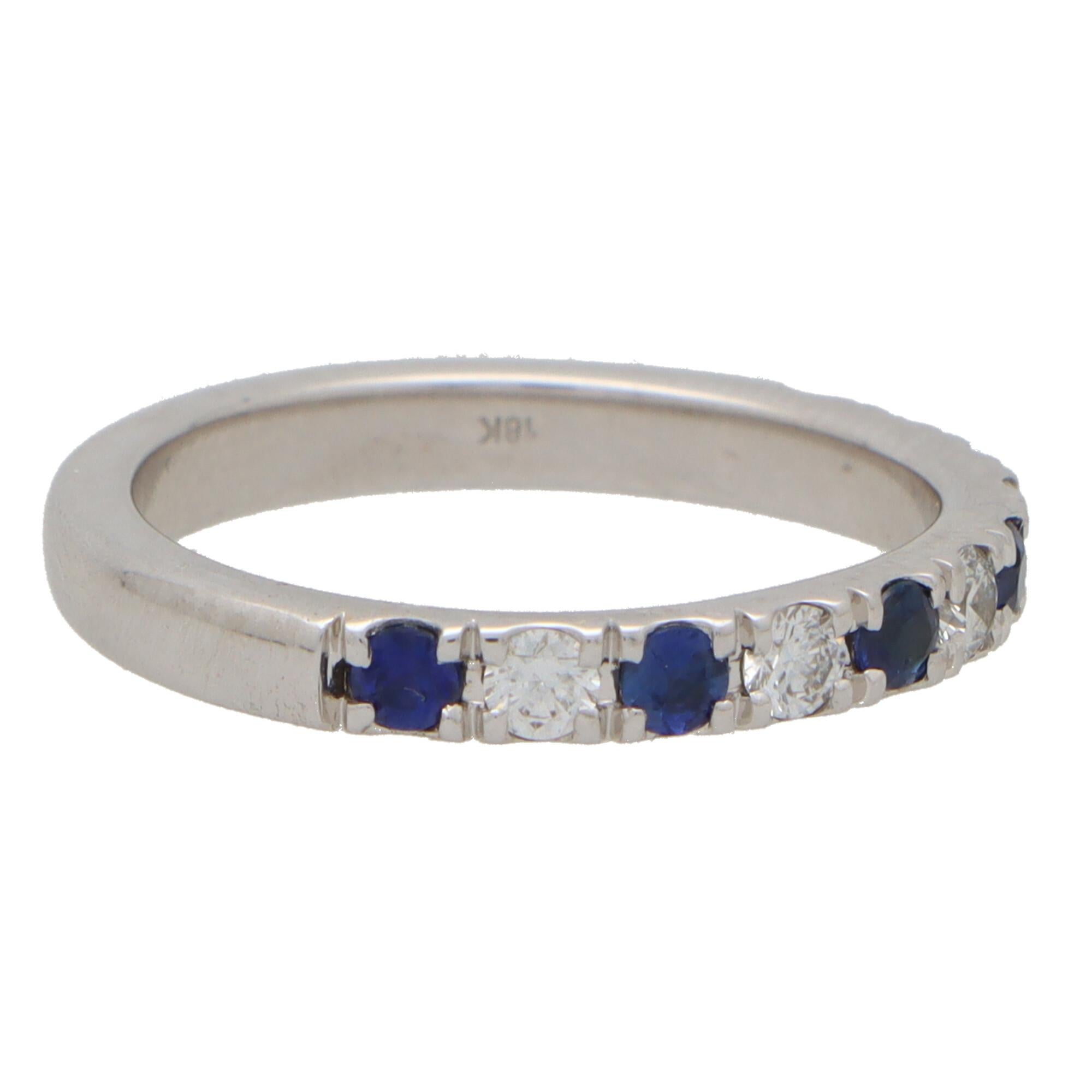 A stylish diamond and sapphire half eternity ring set in 18k white gold. 

The ring is composed of 11 round cut stones altogether, 6 of which being sapphires and 5 diamonds. All the stones are perfectly claw-set in white gold within a 3-millimetre