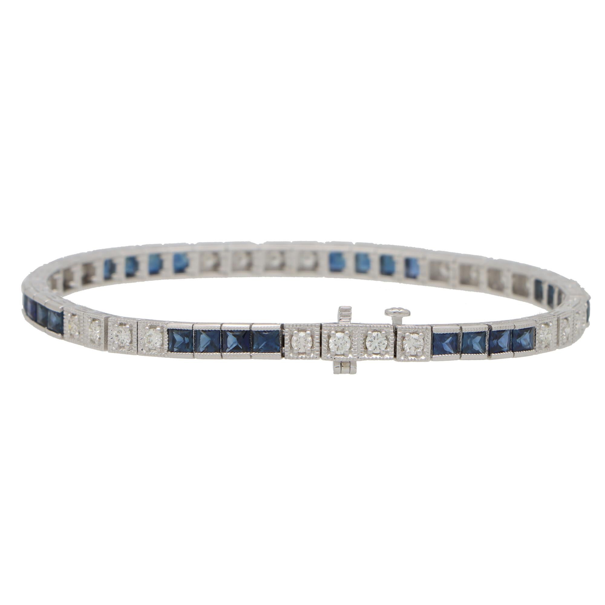A beautiful contemporary diamond and sapphire line bracelet set in 18k white gold.

The bracelet is composed of a grand total of 24 round brilliant cut diamonds and 24 square cut vibrant sapphire stones. All of the stones are securely pressure and