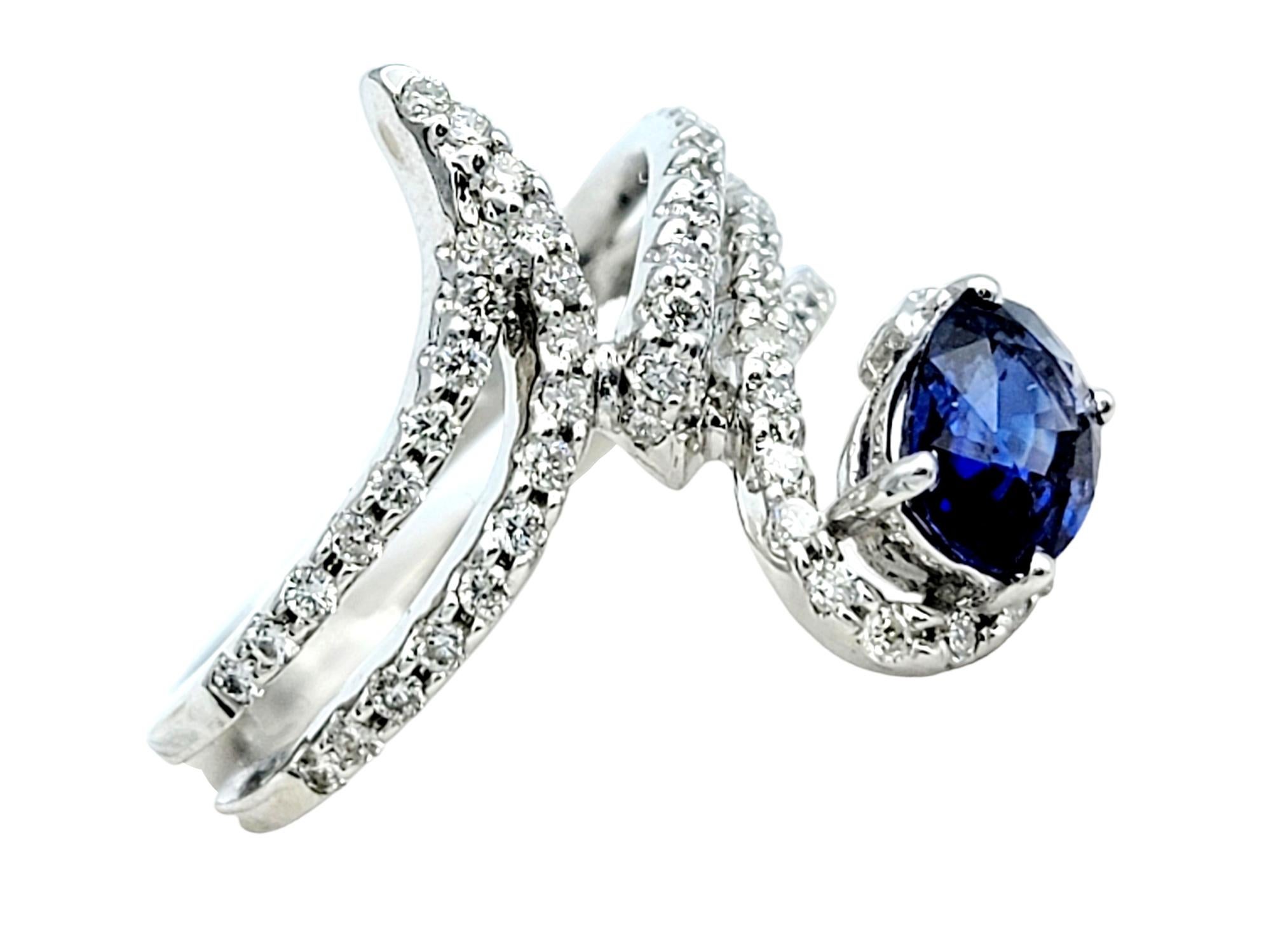 Oval Cut Contemporary Sapphire and Diamond Split Shank Bypass Wrap Ring in 18 Karat Gold For Sale