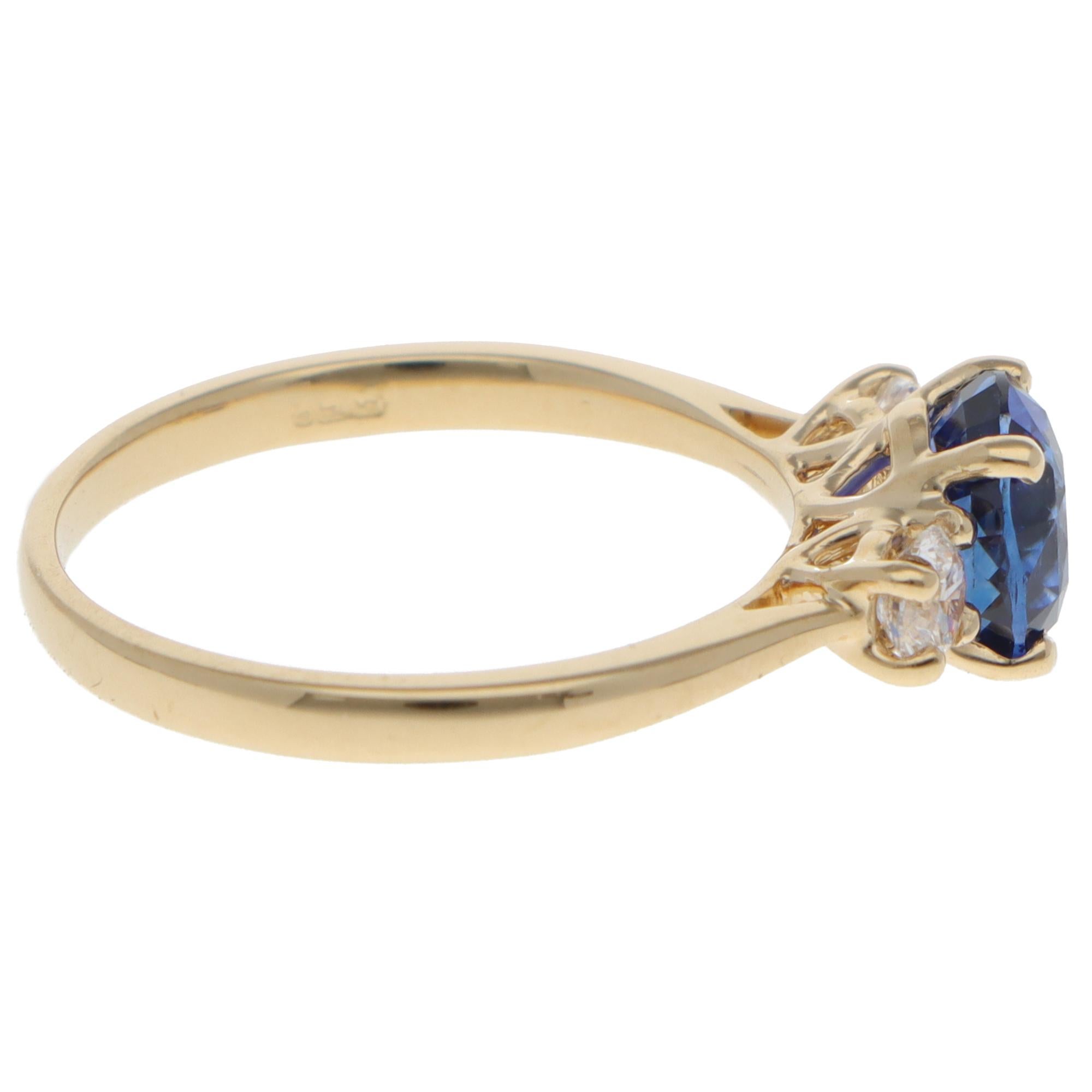 Oval Cut Contemporary Sapphire and Diamond Three Stone Ring in Yellow Gold For Sale
