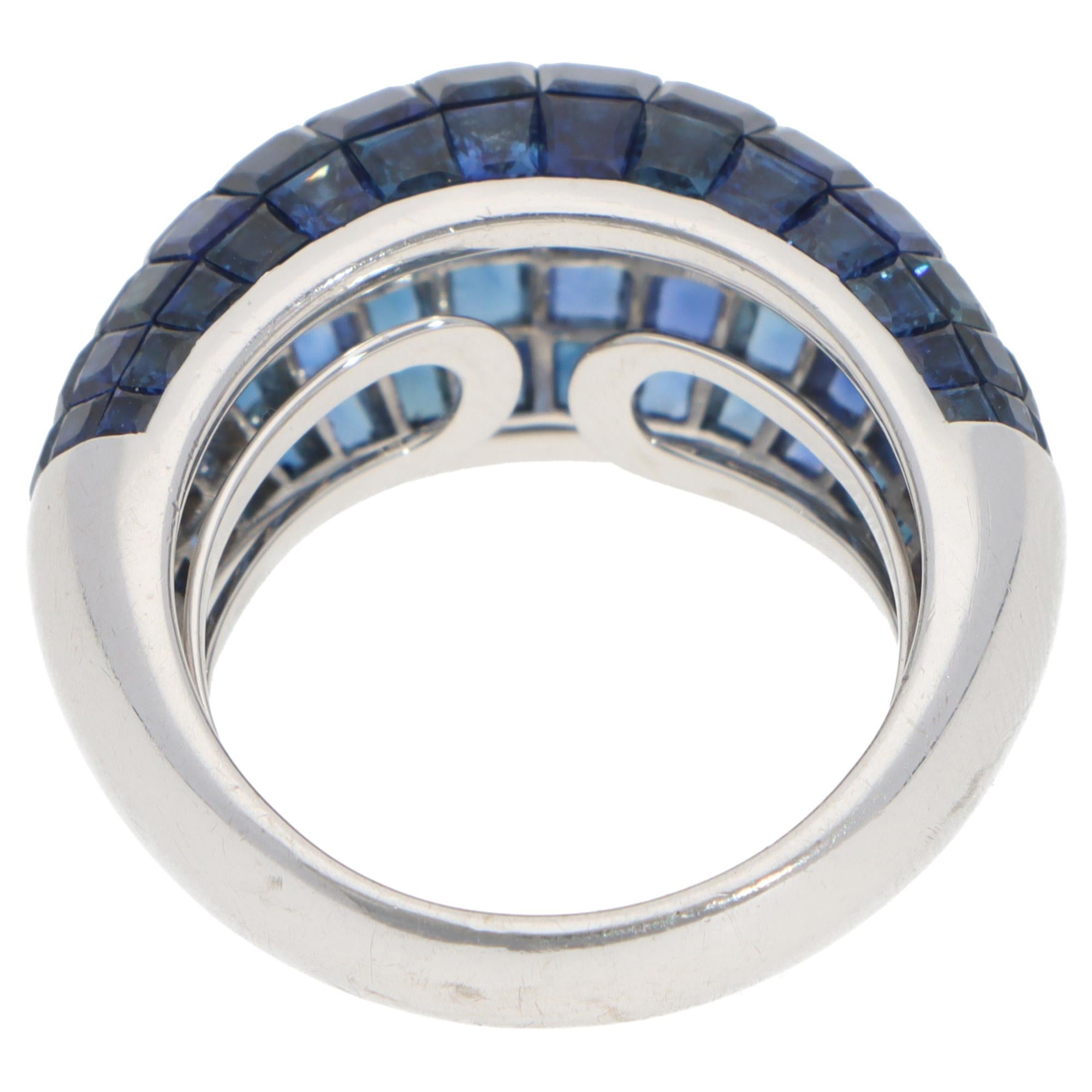 Women's or Men's Contemporary Sapphire Invisible Set Bombe Ring in White Gold For Sale