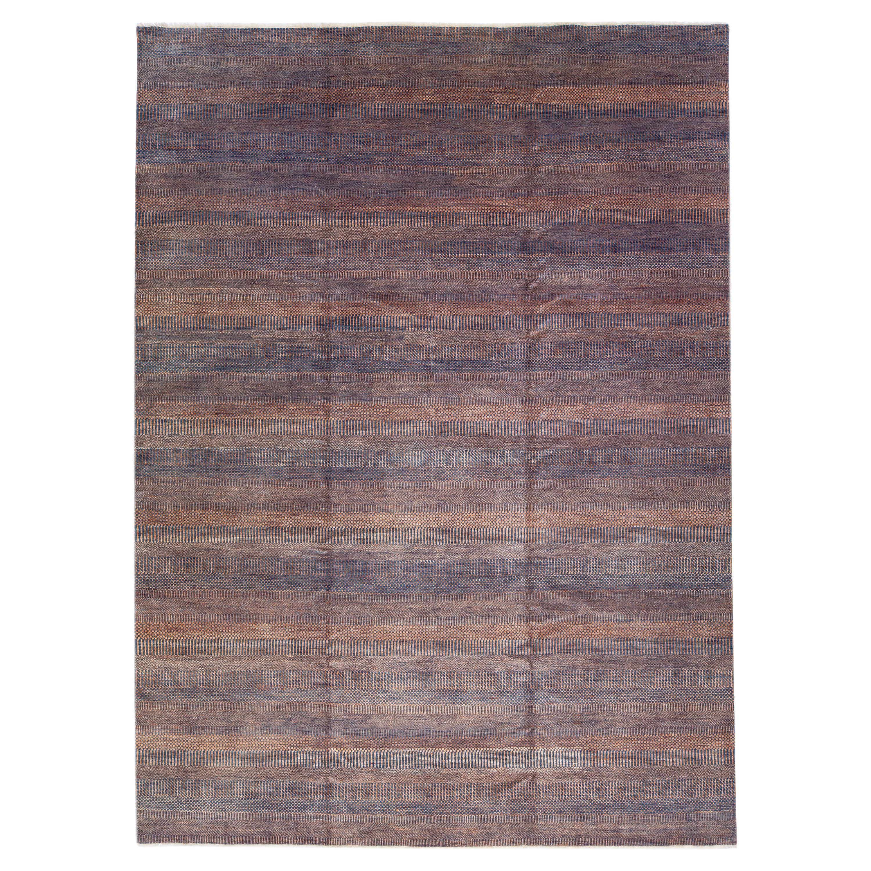 Alfombra contemporánea de lana Savannah con motivo geométrico naranja y azul