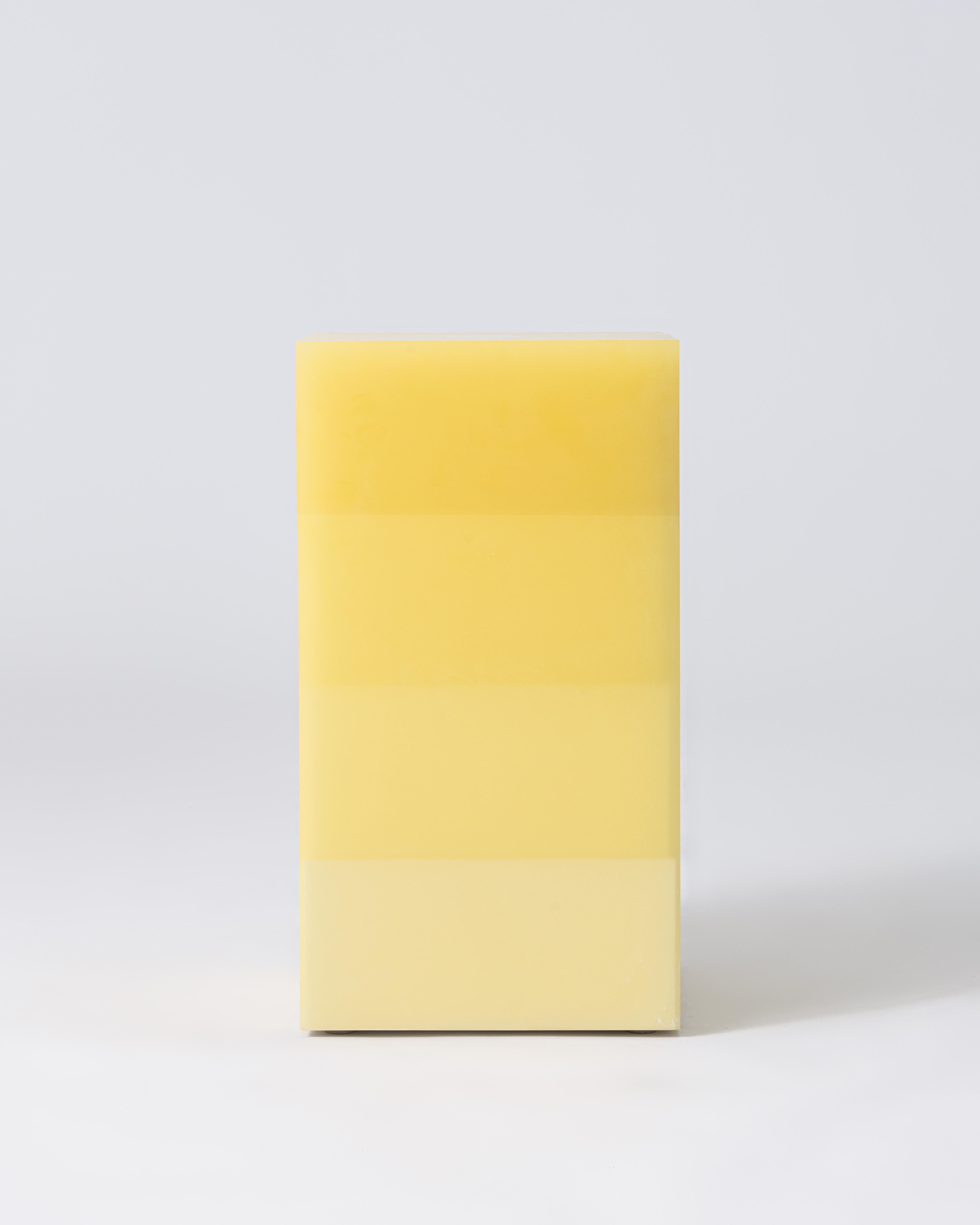 Represented by Tuleste Factory

This stool/side table features four transitioning layers from a light to dark yellow over a stepped white wood core. The interior and exterior facets are sanded to a buttery smooth finish giving the piece a soft glow