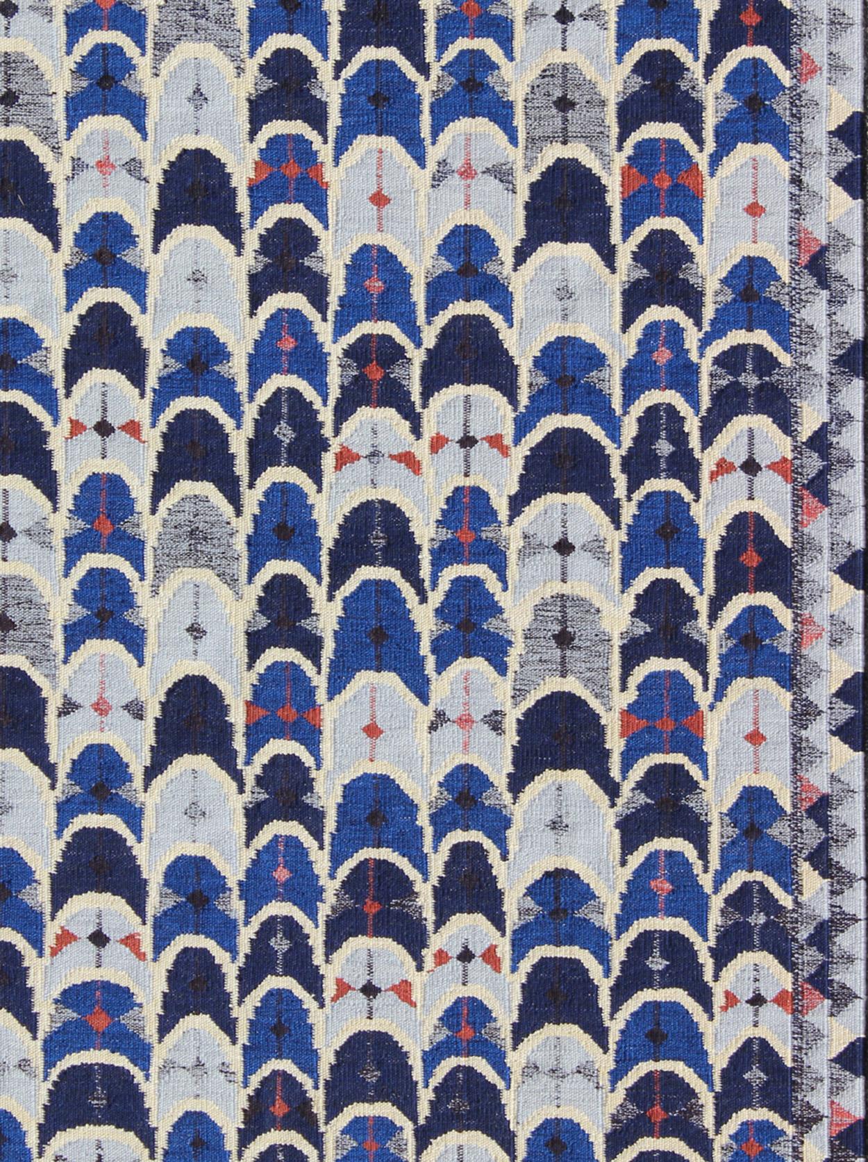 Contemporary Scandinavian Design flat-weave rug in blue, charcoal, red, rug rjk-1058-shb-027-01, country of origin / type: Scandinavia / Scandinavian Modern

This modern Scandinavian design flat-weave rug is inspired by the work of Swedish textile