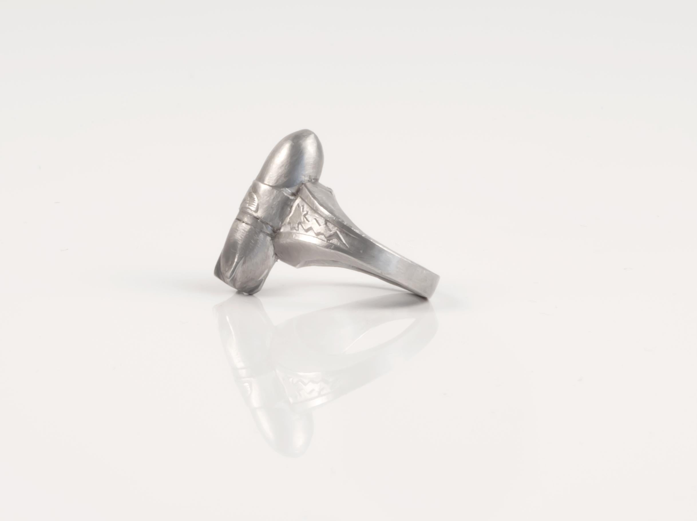 A significant and important piece with political overtures. Modelled on the KIX Cereal ring 'The Lone Ranger' from 1947, just after WW2 and the development of atomic energy and the atomic bomb which ended WW2.  Made of tin, in the workshop of Nanna