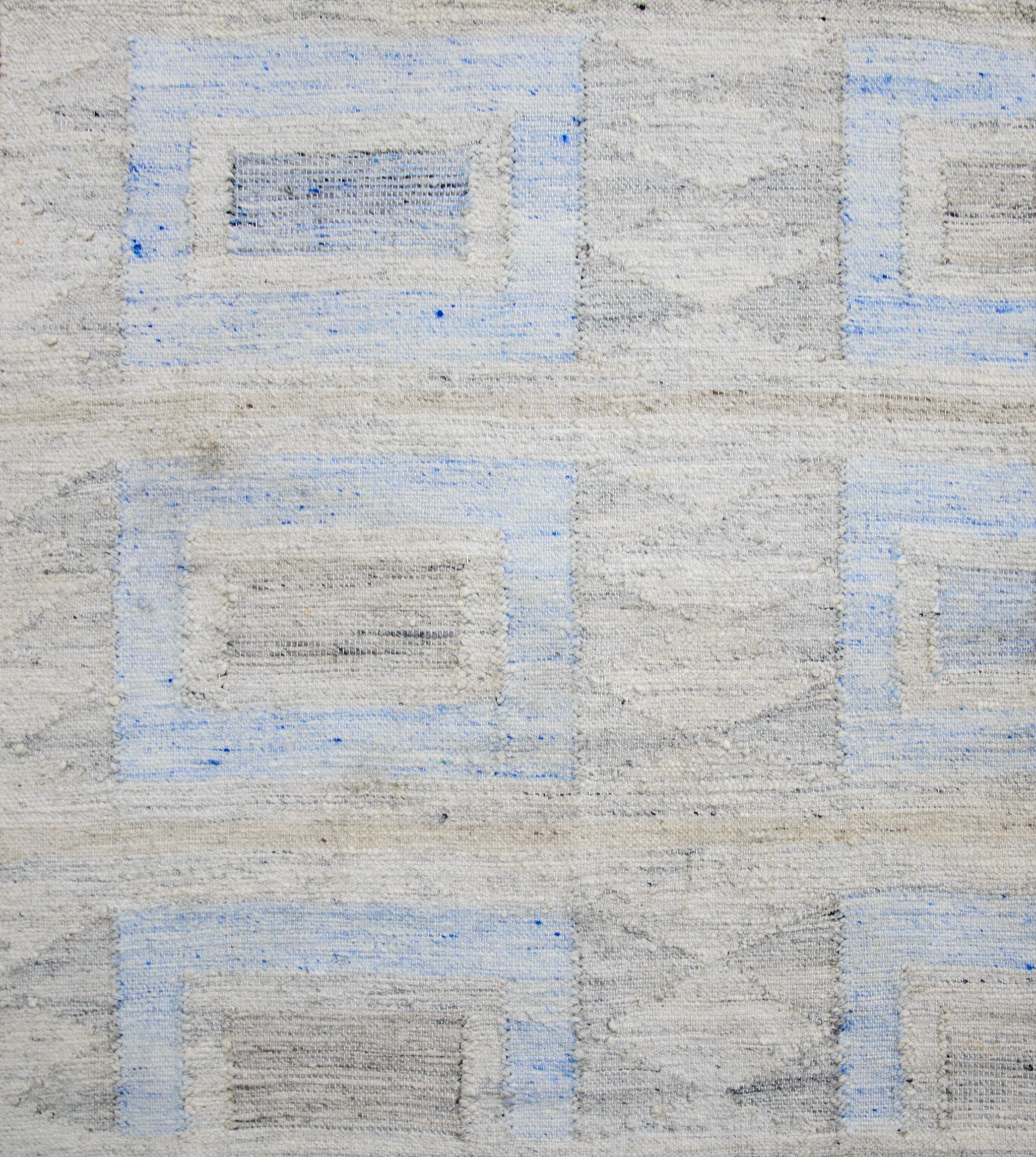 Modern area rug handwoven in Scandinavian design using fine wool and organic dyes. It features an exquisite beige field with blue and brown squares all-over. This piece will surely look fabulous in modern and contemporary interiors. It has a nice 9’