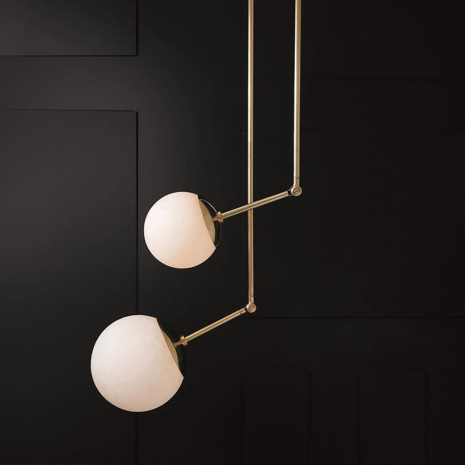 Contemporary Sculpted Brass & Glass Pendant, Tango Two Globe by Paul Matter

Tango is born from playful experimentation with vintage lighting components.
Burnt, aged brass and etched glass are combined to create lighting fixtures that fuse