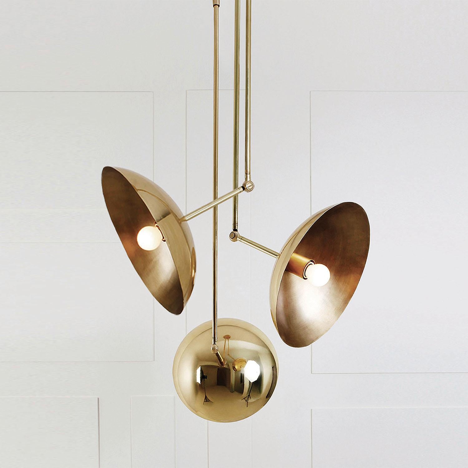 Contemporary Sculpted Brass Pendant, Tango Three Dome by Paul Matter

Tango is born from playful experimentation with vintage lighting components.
Burnt, aged brass and etched glass are combined to create lighting fixtures that fuse sculptural form