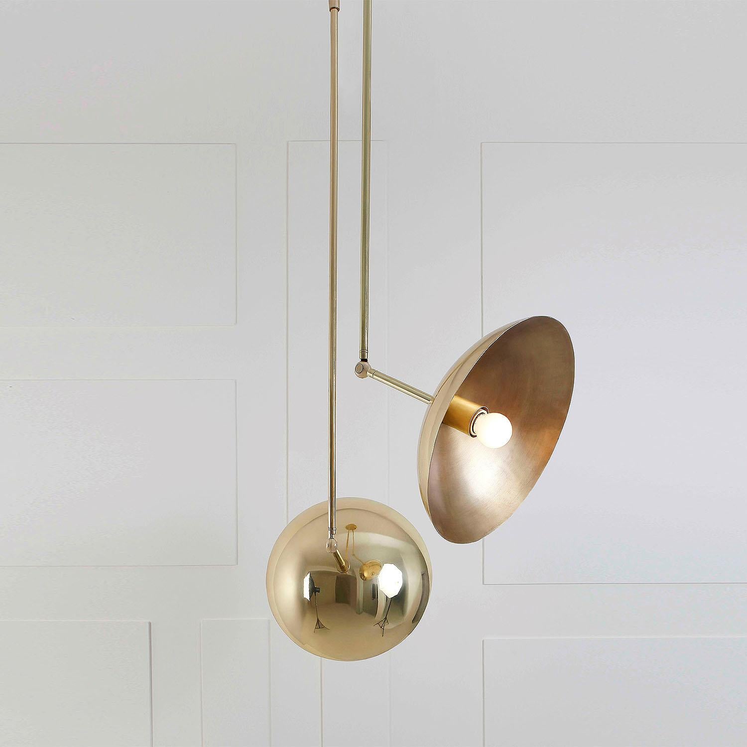 Contemporary Sculpted Brass Pendant, Tango Two Dome by Paul Matter

Tango is born from playful experimentation with vintage lighting components.
Burnt, aged brass and etched glass are combined to create lighting fixtures that fuse sculptural form