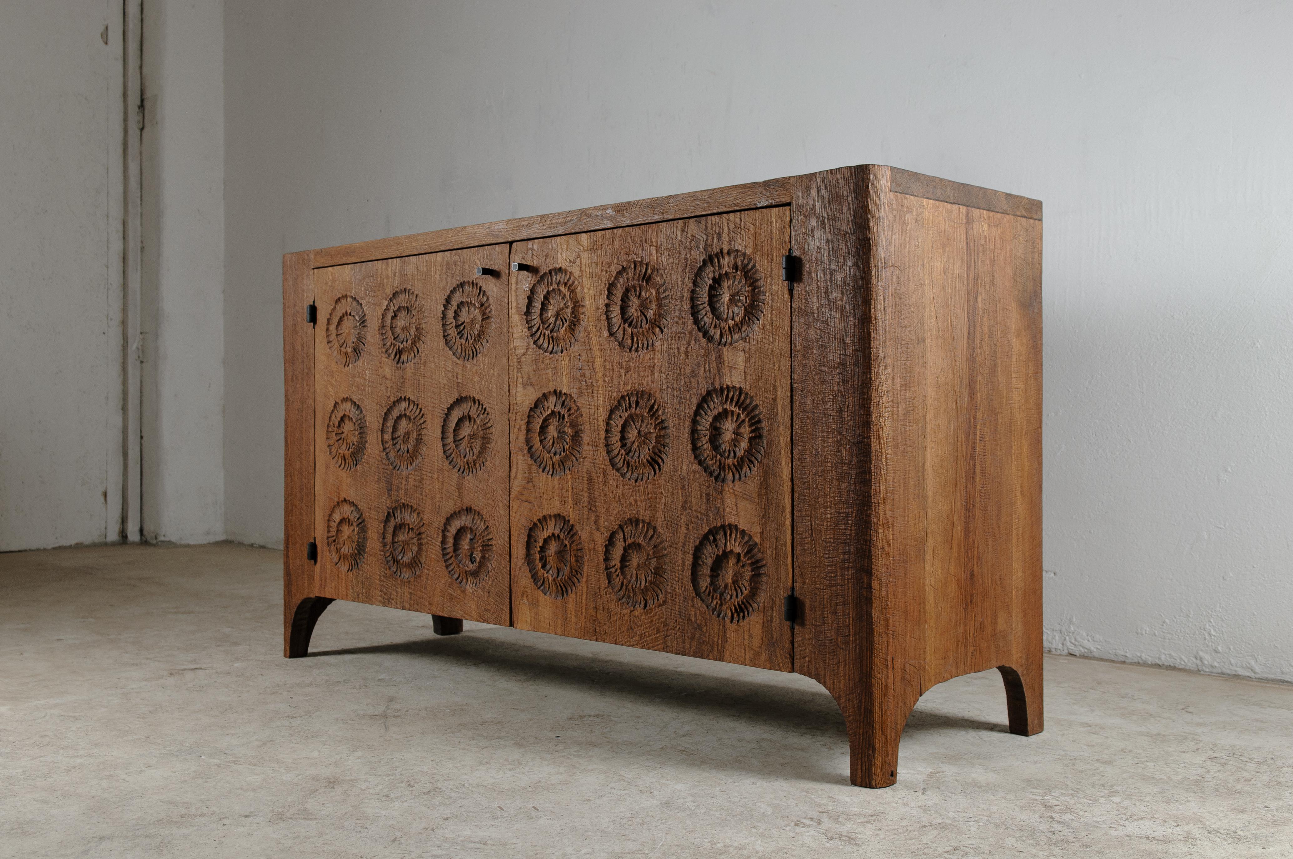 Contemporary sculpted sideboard in solid oak and linseed oil.

Dimensions: 
H. 85 x W. 160. x D. 45 cm

Unique piece made to order.

Founded by artist Denis Milovanov, SÓHA design studio conceives and produces furniture design and decorative