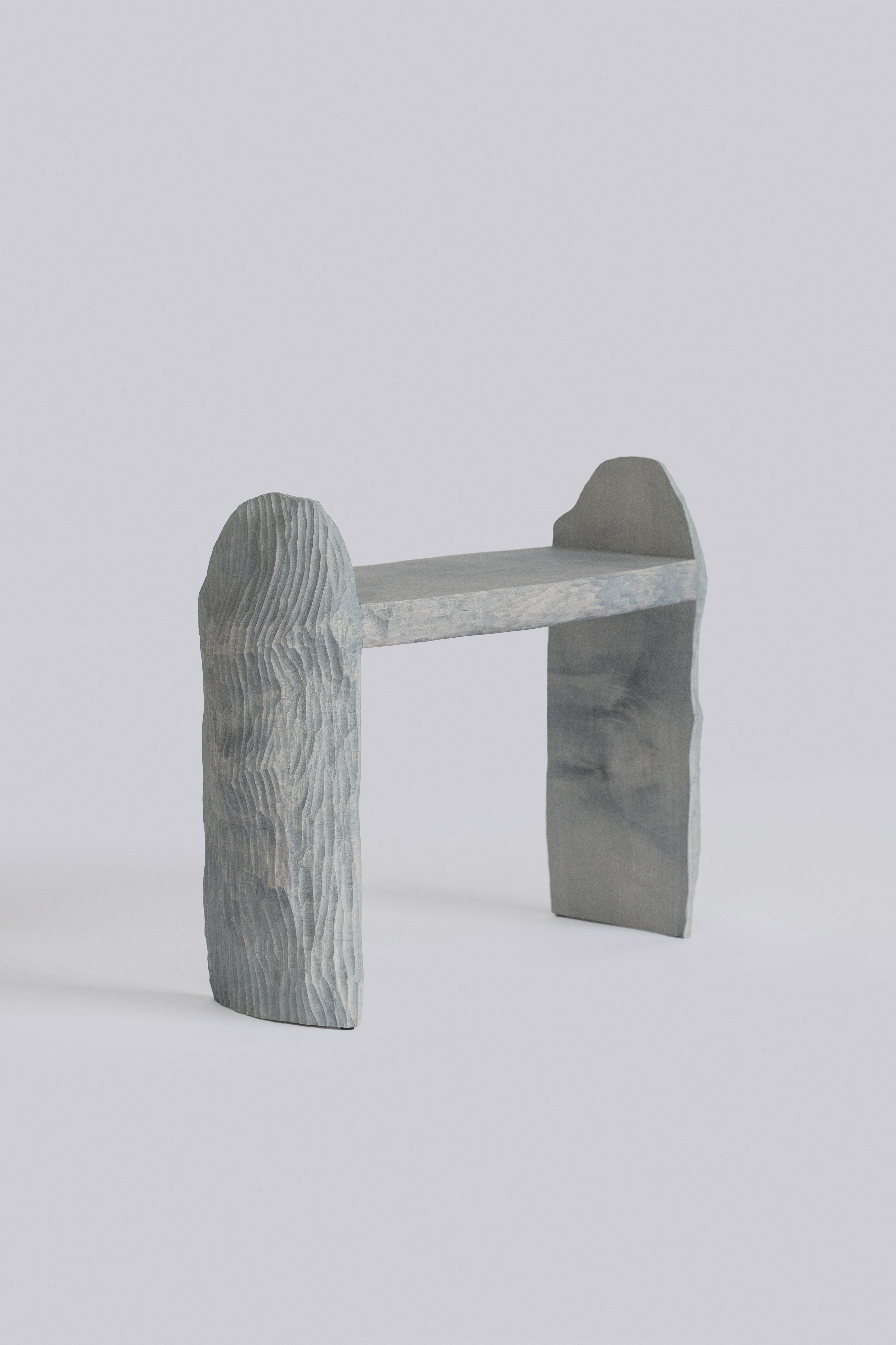 Intuitive Archaisme is a collection of furniture whose design and manufacturing process is based on the primitive instinct of assembling shapes to create a structure. The wood is worked with a gouge, revealing its structure as the tool passes over