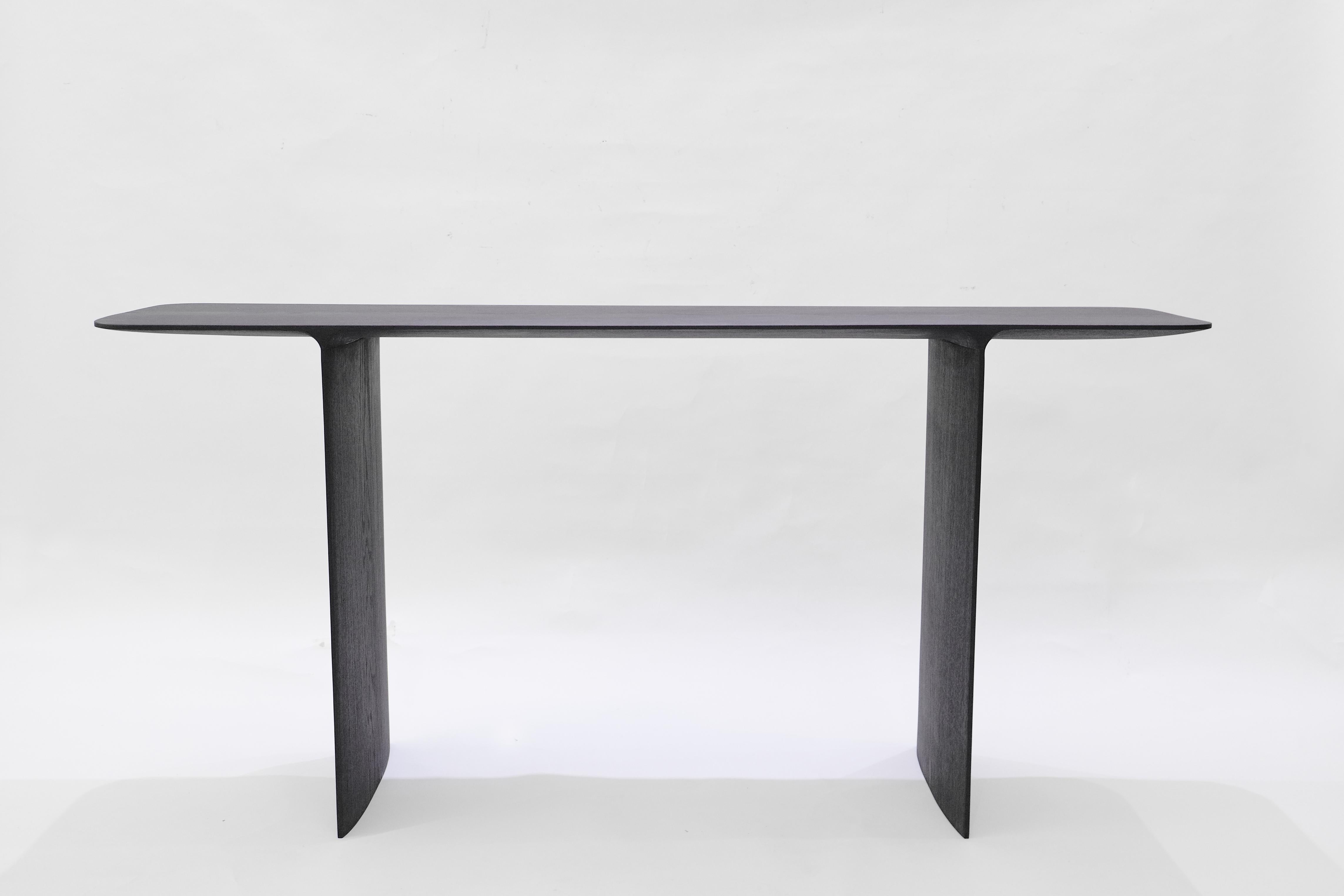 Intuitive Archaisme is a collection of furniture whose design and manufacturing process is based on the primitive instinct of assembling shapes to create a structure. The wood is worked with a gouge, revealing its structure as the tool passes over