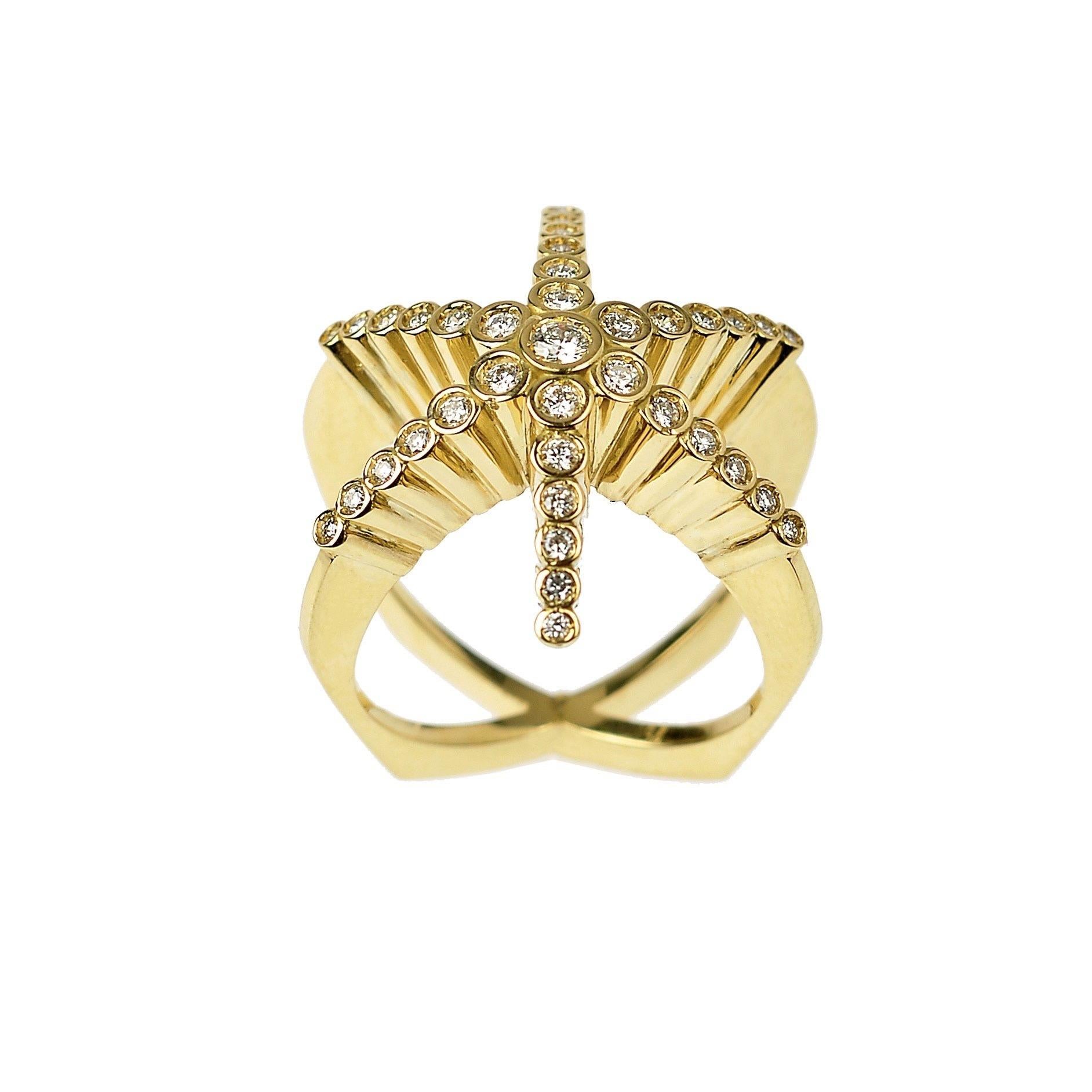 The ‘Finger hugging Star’, ring is crafted in 18K yellow gold hallmarked in Cyprus. This spectacular statement ring, comes in a highly polished finish and features White VS, Diamonds totaling 0,63 Cts. One of Maria Kotsonis’s most popular stand