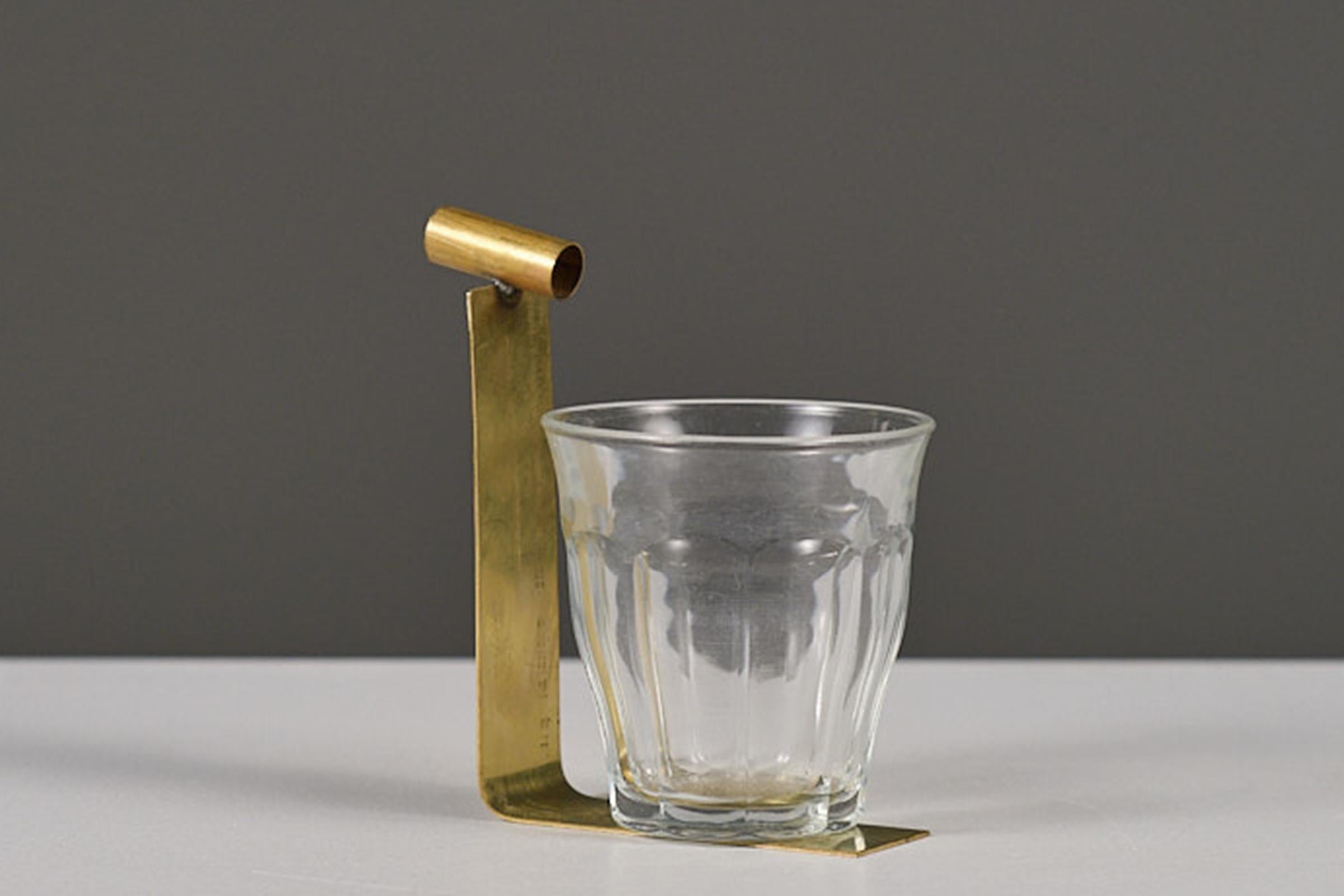 Contemporary sculptural handmade ashtray of collectible design made with brass and a glass. Little Friends is a collection of ashtrays and some other little trays. 
Every Little Friend is a composition game out of scrap material or leftovers of the