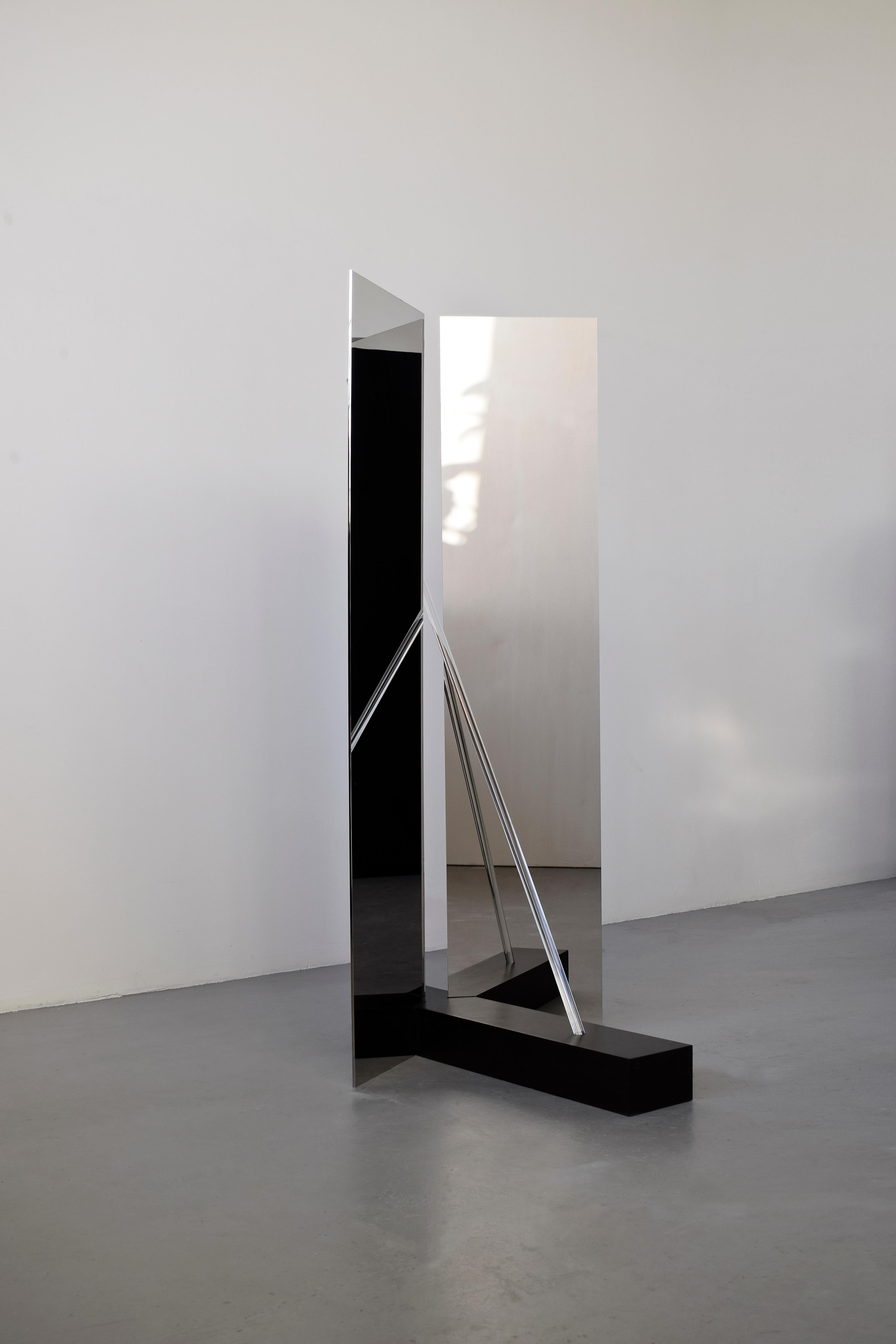 Elusive 04
A beautiful piece exploring the line between visible and invisible: half mirror, half sculpture.
By Maximilian Michaelis.

Belgium bluestone, polished stainless steel, acrylic glass, Led
Measure: 155 x 105 x 63 cm.