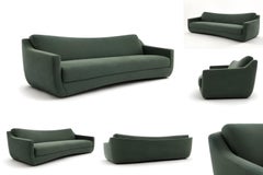 Contemporary Sculptural Sofa with Curved Base and Tailored Upholstery