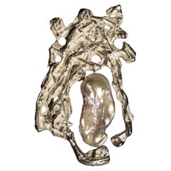 Contemporary, sculptural solid silver and freshwater pearl pendant