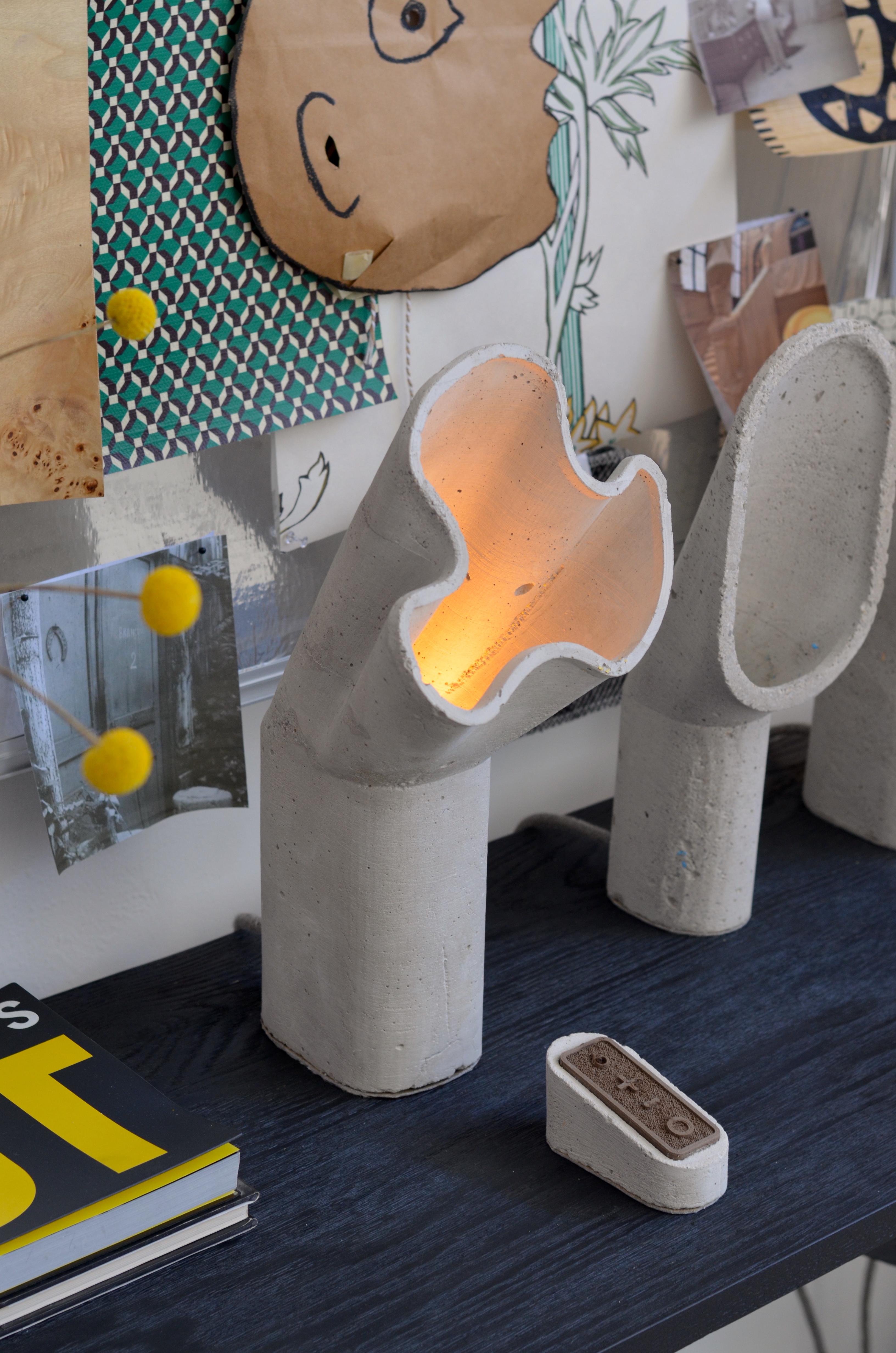 The 'Aline' is a sculptural concrete lamp designed by London-based contemporary lighting designer James Haywood.

It is created using low-impact concrete, with an environmental footprint 45 times smaller than that of Portland cement, recycled PETG