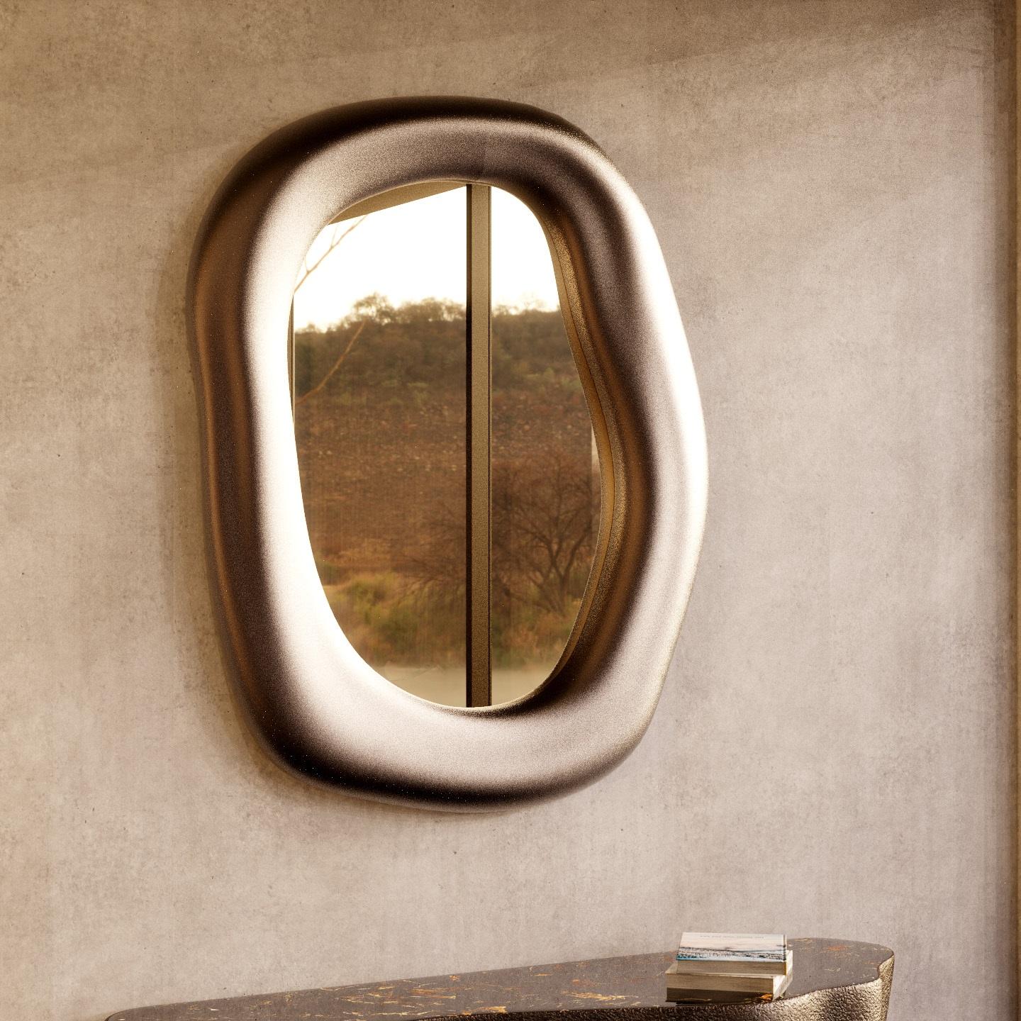 Contemporary wall mirror featuring organic shaped frame crafted of matt aluminum. Meticulously handmade by skilled artisans one piece at a time.
Pictured materials: Matt aluminum and copper bronze mirror.
Custom sizes available upon request. 
 
We