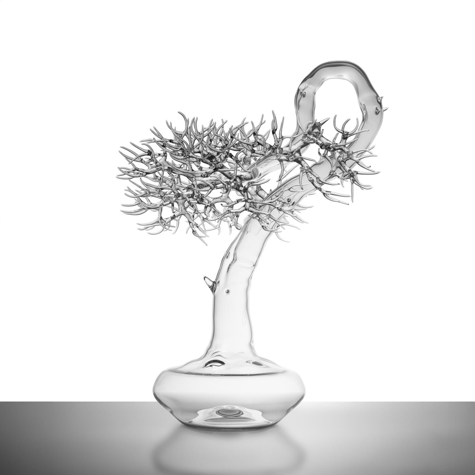 Masterfully crafted by renowned Italian artist Simone Crestani

This exquisite Hand-Blown Glass Bonsai Tree Sculpture is a breathtaking representation of the delicate beauty and profound symbolism inherent in the art of bonsai. Created by the master