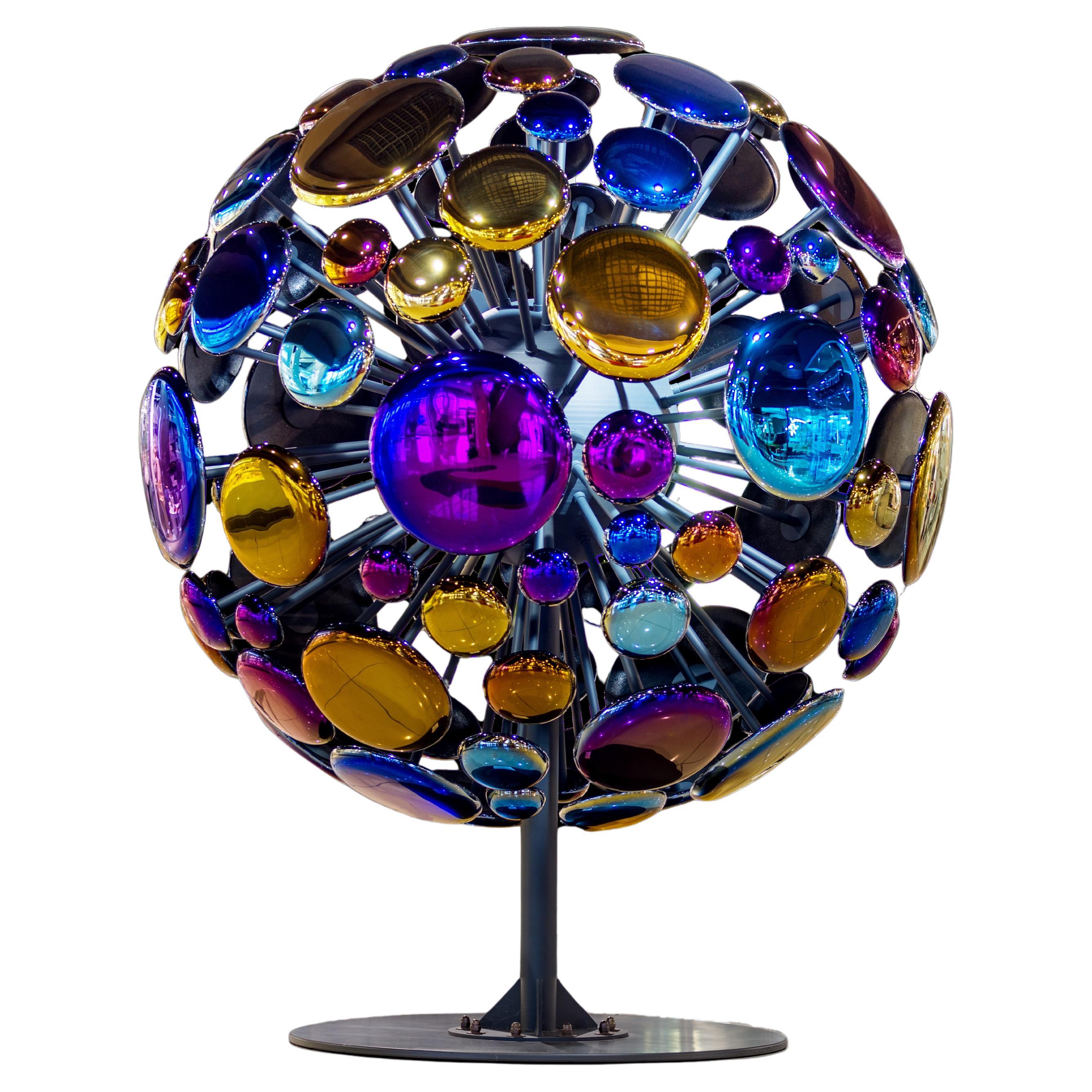 Scultura contemporanea "Space Expansion" Colorata realizzata in vetro e titanio.