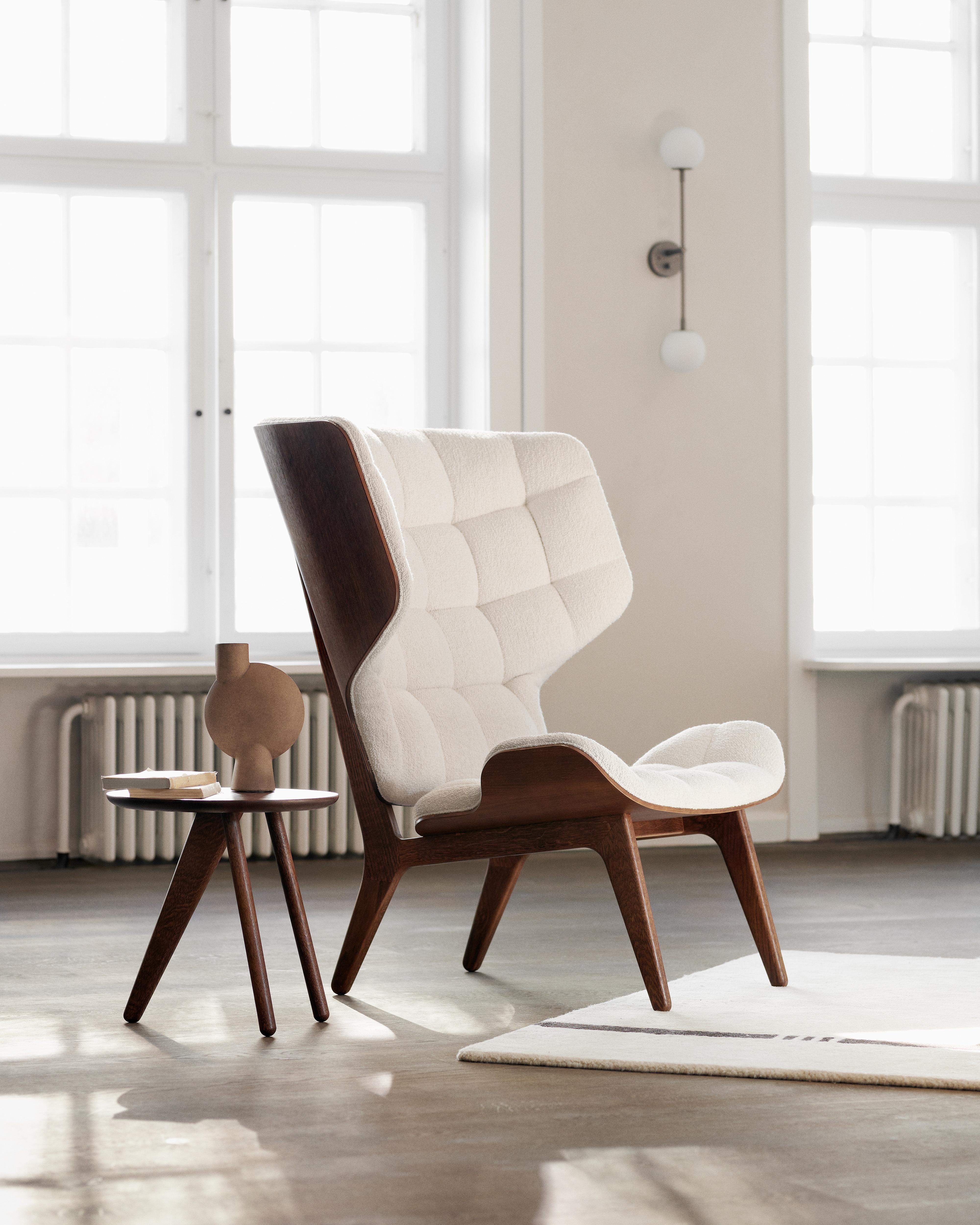 Mammoth chair + ottoman
Signed by Rune Krøjgaard & Knut Bendik Humlevik for Norr11. 

Dimensions:
- Chair: W 89 cm / D 87 cm / H 104 cm / SH 35,5 cm
- Ottoman: W 61,5 cm / D 53 cm / H 37 cm

Models shown on the picture:
Wood: Dark Smoked