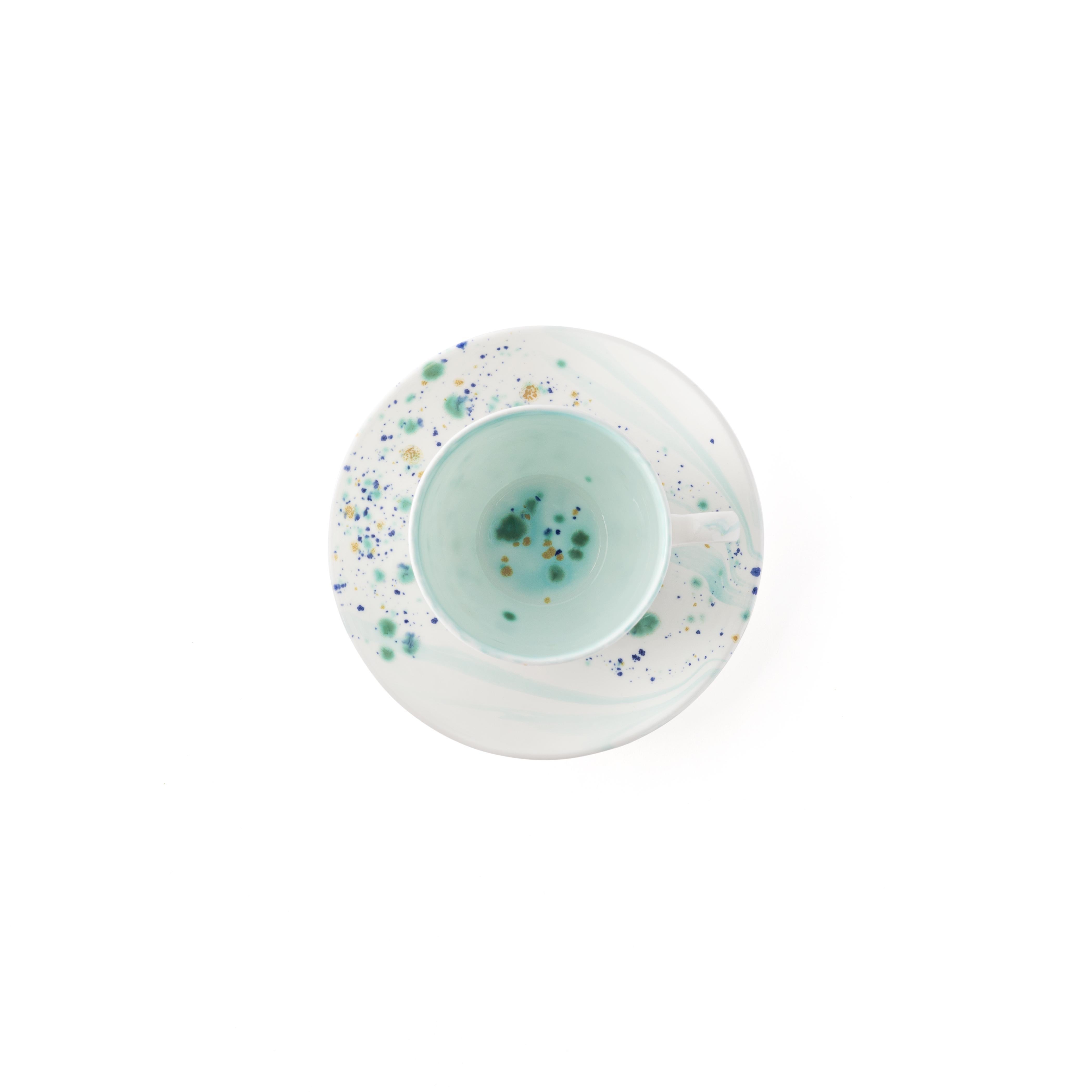 Handcrafted in Italy from the finest porcelain, these coffee cups and saucers from the Blue Marble Collection have a warm, berry-like enamel decoration painted in dots, drips and strokes that give it a fresh and dynamic appearance.

Set of 2