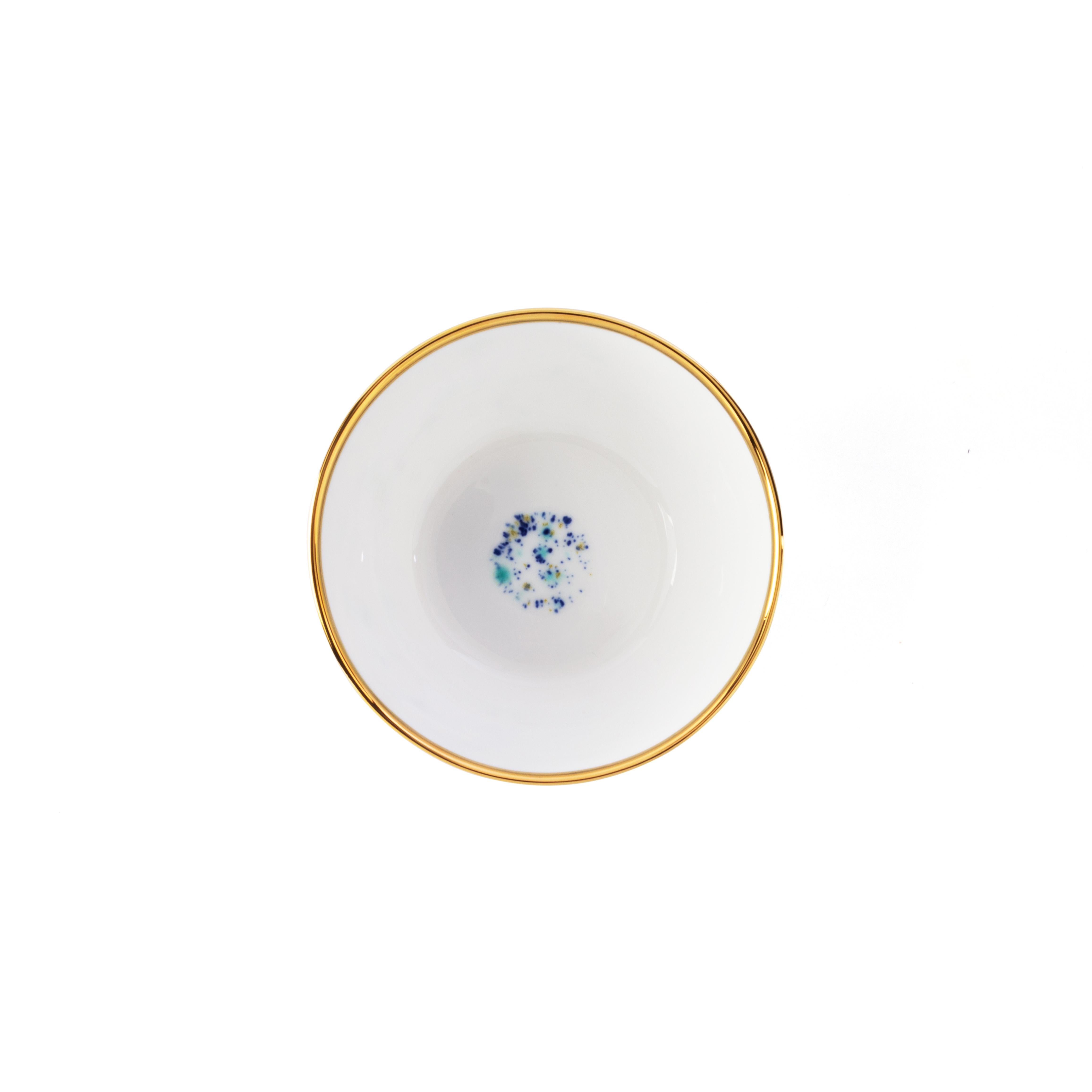 Handcrafted in Italy from the finest porcelain, this Blue Marble Fruit Bowl is decorated outside with a blue yellow and green décor crowned by an elegant golden rim; the inside is white with a dotted Blue Marble decor at the bottom.

Set of 2 fruit