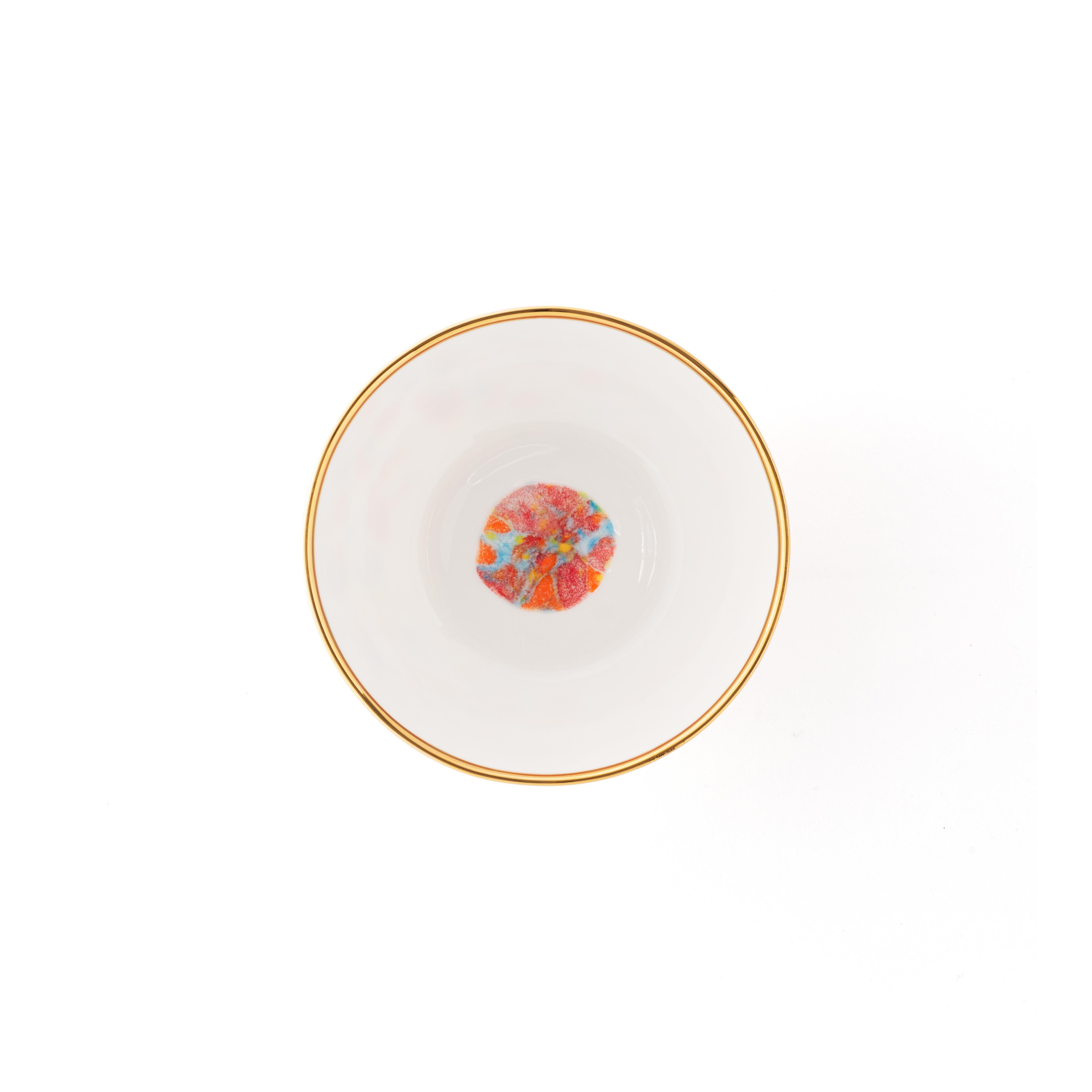 Handcrafted in Italy from the finest porcelain, these Confetti fruit bowls are decorated outside with a lively multi-color decor crowned by an elegant golden rim; the inside is a brilliant white with a dotted multi-color decor at the bottom.

Set