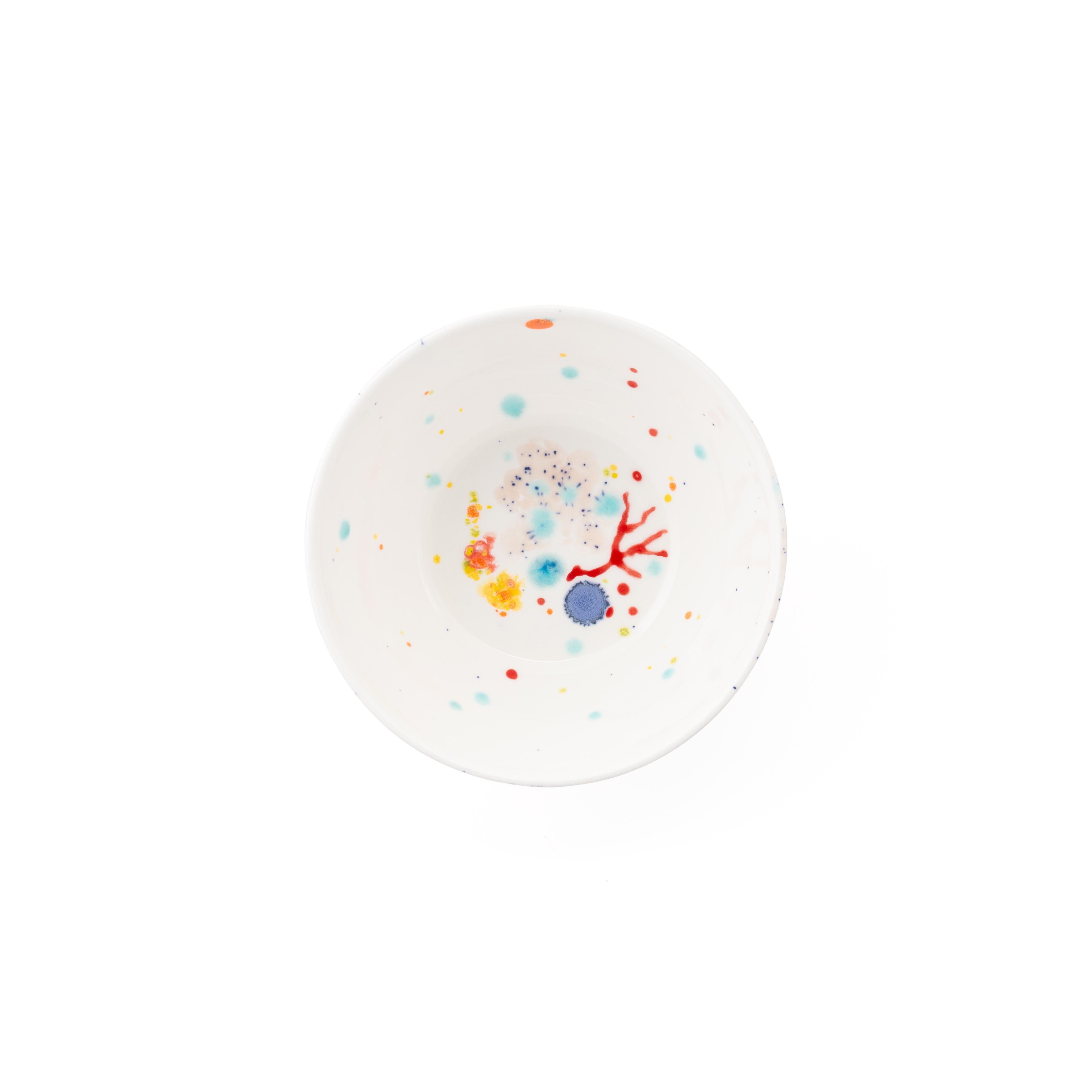 Handcrafted in Italy from the finest porcelain, these white seabed fruit bowls have corals lying on a bright bottom surrounded by mysterious multicolored gems floating amid brushes of light pink sand sprinkled with black dots.

Set of 2 white