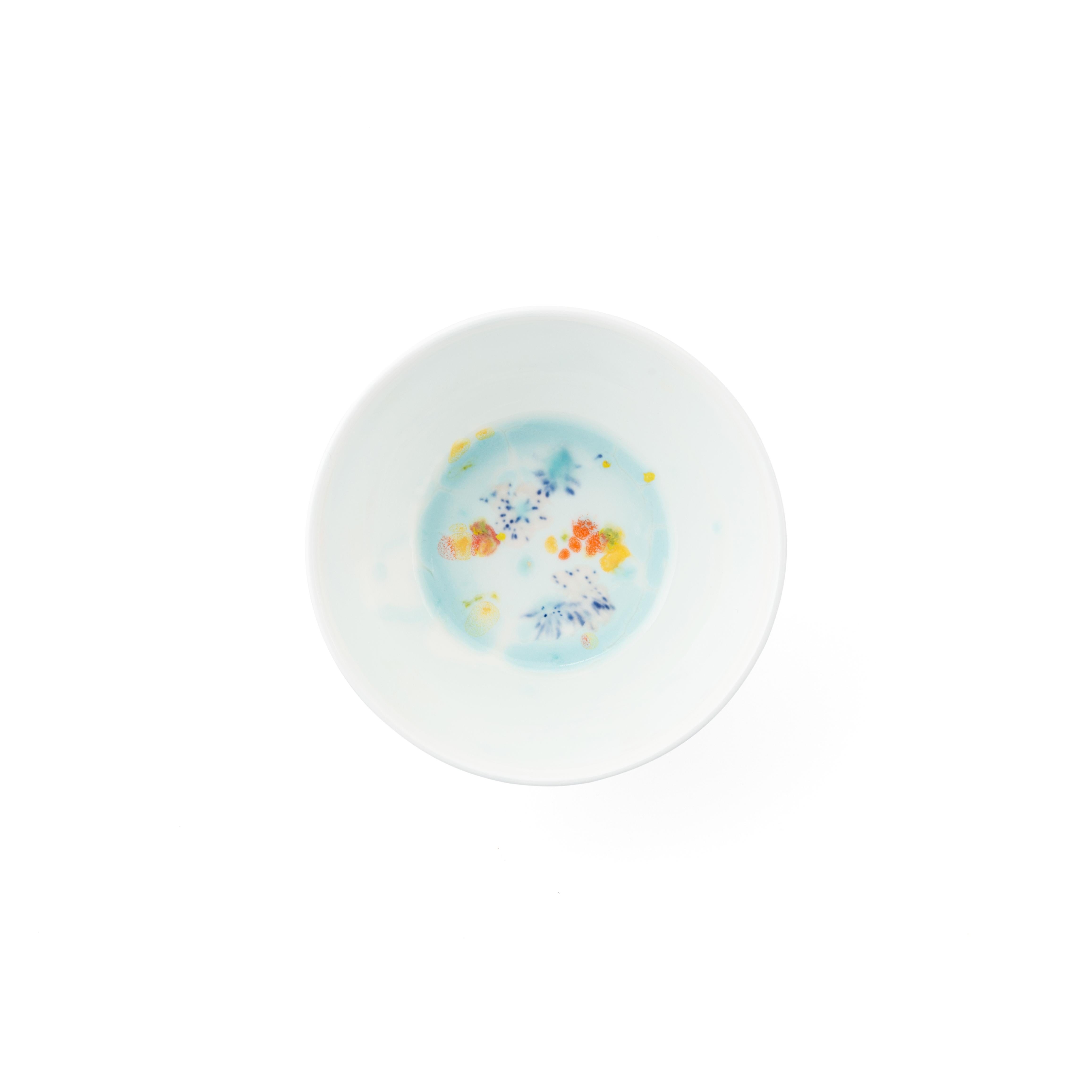 Handcrafted in Italy from the finest porcelain, these blue seabed fruit bowls have corals lying on a bright bottom surrounded by mysterious multicolored gems floating amid brushes of light pink sand sprinkled with black dots.

Set of 2 blue seabed