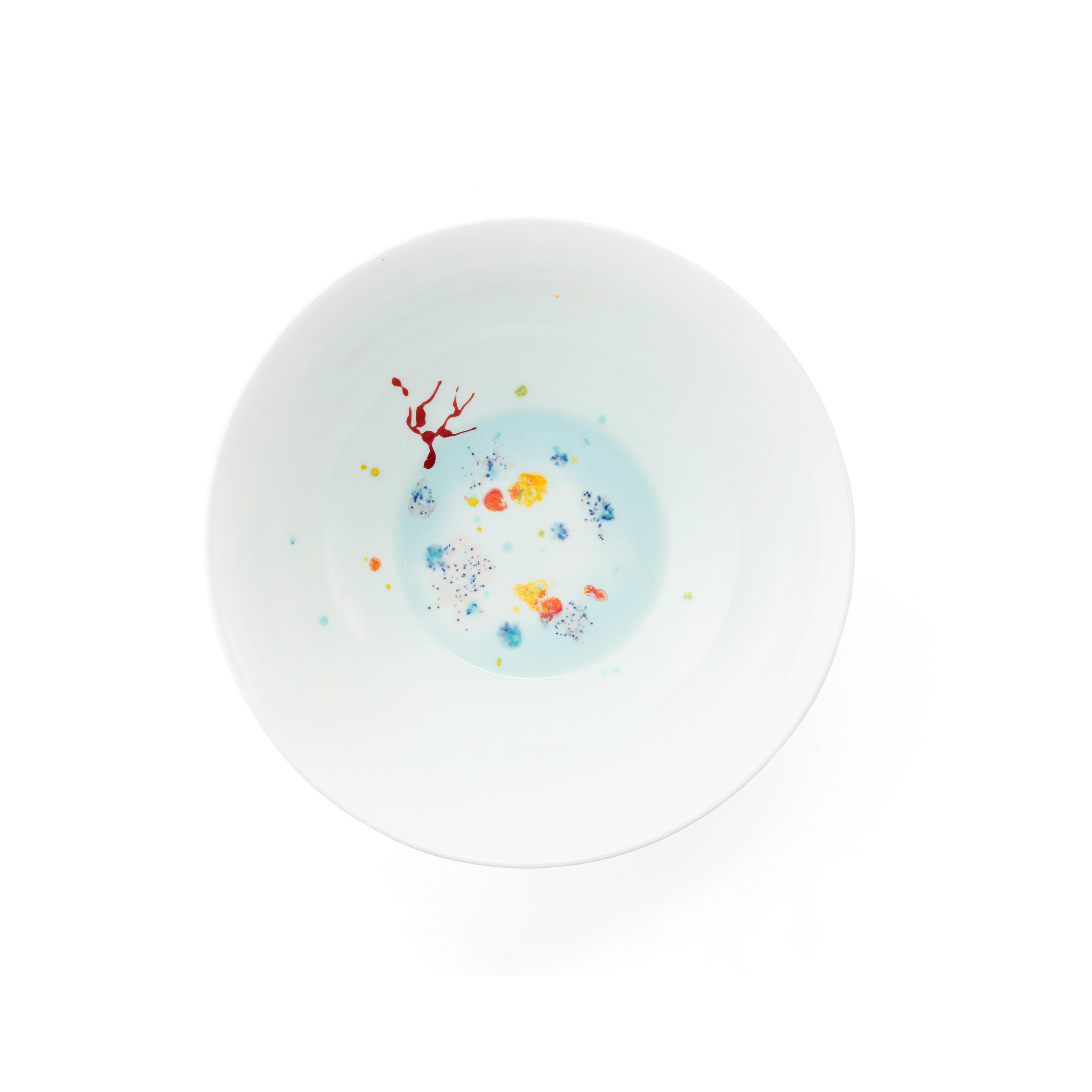 Handcrafted in Italy from the finest porcelain, these blue seabed soup coupe plates have corals lying on a bright bottom surrounded by mysterious multicolored gems floating amid brushes of light pink sand sprinkled with black dots.

Set of 2 blue