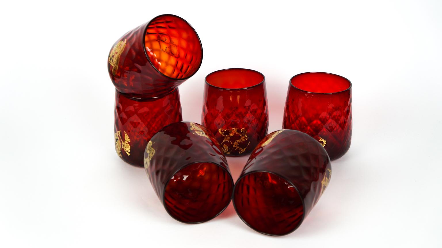 Luxury is a set composed of 6 glasses for water or wine in Murano glass entirely handmade in red color with 24-karat gold leaf details. 

This set is a combination of design and elegance, every single detail is worked with great care and