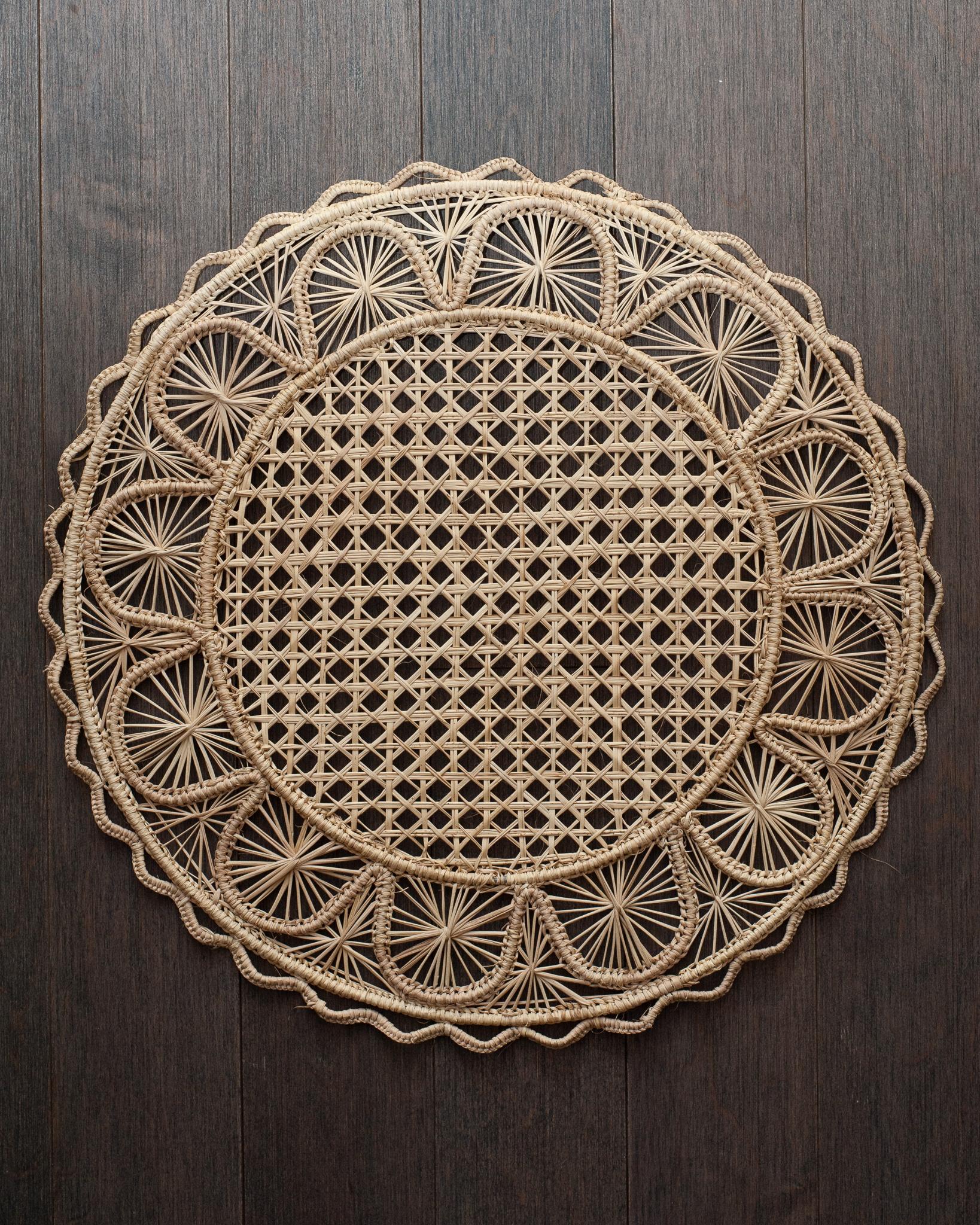 Uplift your table with these stunning handwoven rattan placemats in natural rattan. Finely crafted by expert artisans, these pieces all showcase the classical technique of weaving in a modern way. From Jean Michel Frank to the House of Dior, rattan