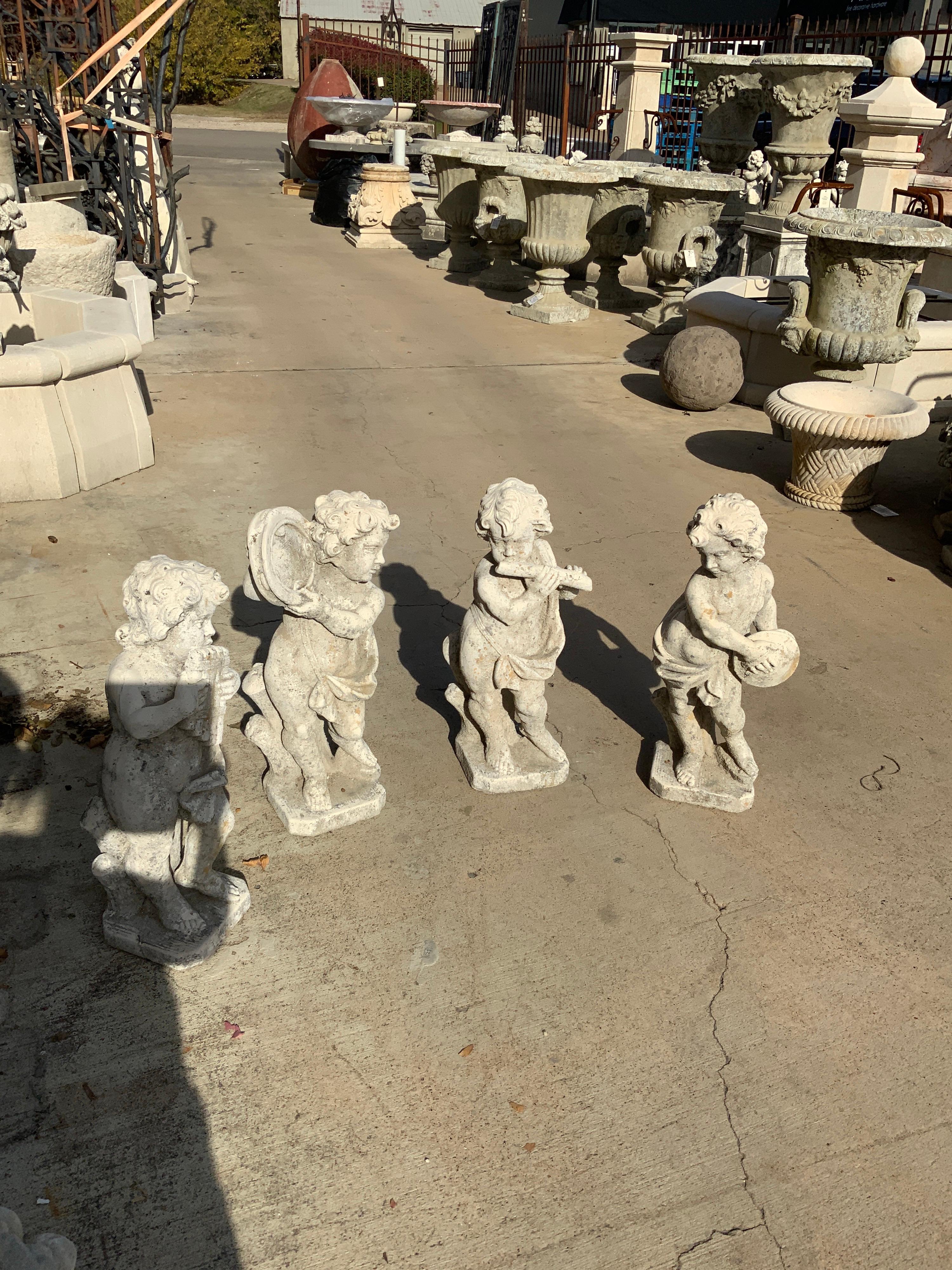 Contemporary Set of Four Musical Cherubs In Distressed Condition For Sale In Dallas, TX