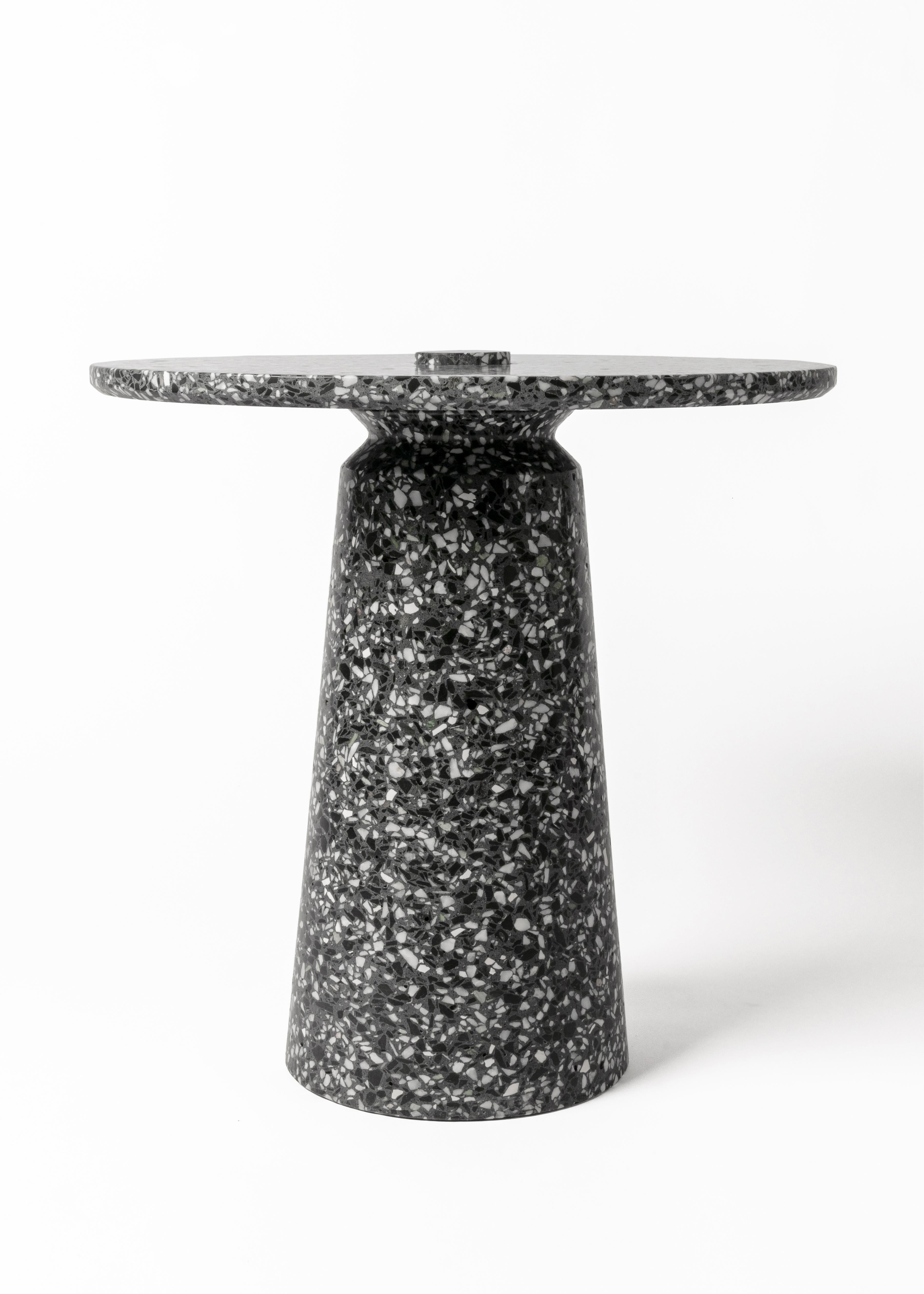 '8' side table in terrazzo (Black / white)

Measures: Ø 50 cm × H 50.3 cm

Bentu Design furniture and lightings derive its uniqueness from the simplicity of its forms and its materials. Designed and manufactured by the designers of Studio Bentu
