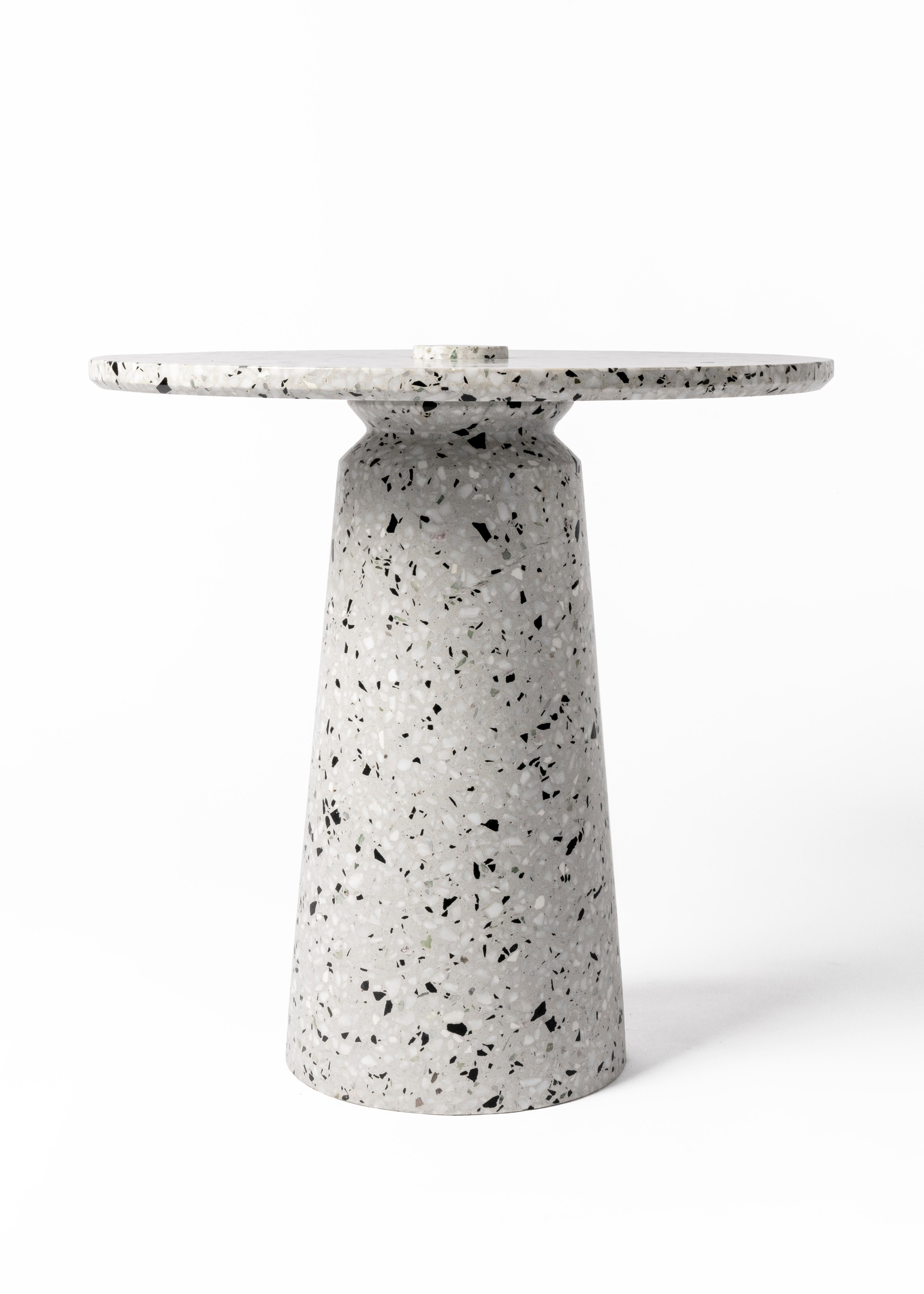 '8' side table in terrazzo (Black / White)

Measures: Ø 50 cm × H 50.3 cm

Bentu Design furniture and lightings derive its uniqueness from the simplicity of its forms and its materials. Designed and manufactured by the designers of Studio Bentu
