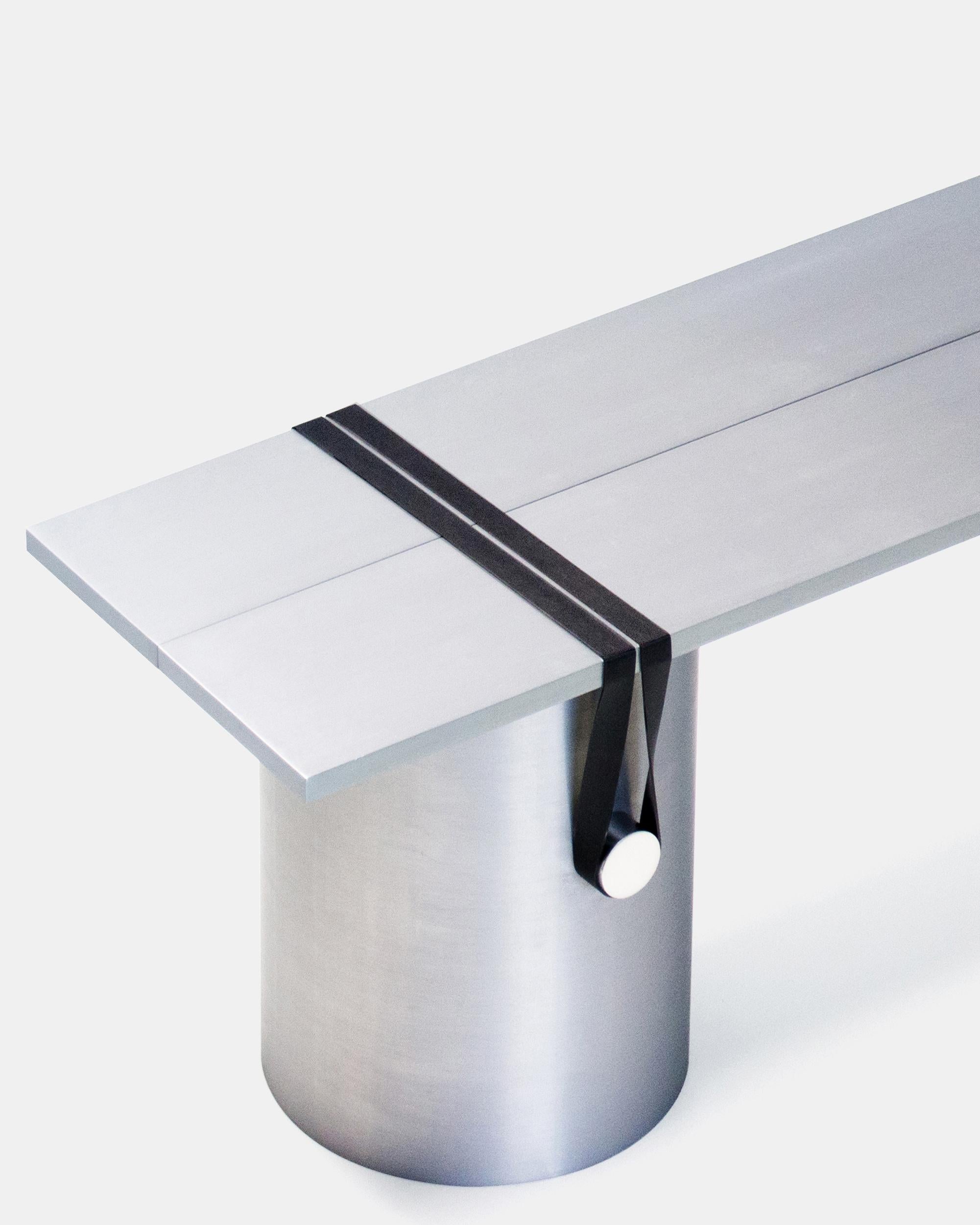 Contemporary side table/bench by Johan Viladrich
Bench/table
Anodised aluminum, rubber
Size: L 160, W 40, H 40 cm
Approximate 60kg
Limited Edition of 5 + 1AP

The table is composed of two brushed aluminium plates leaning onto three lightly