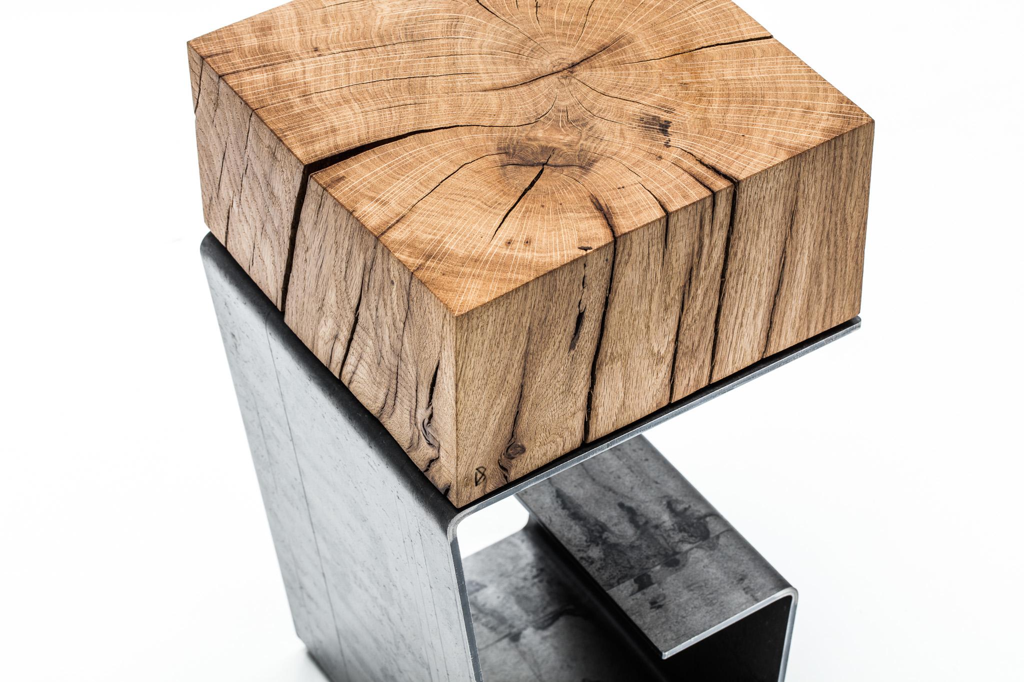 THE LINE Side Table

It is the G-shaped table made of the combination of the 200/300-year-old oak and the raw steel. The oak is drummed up from the French, reclaimed beams and undergoes natural drying for 10 - 15 years in the Cotswalds area in Great