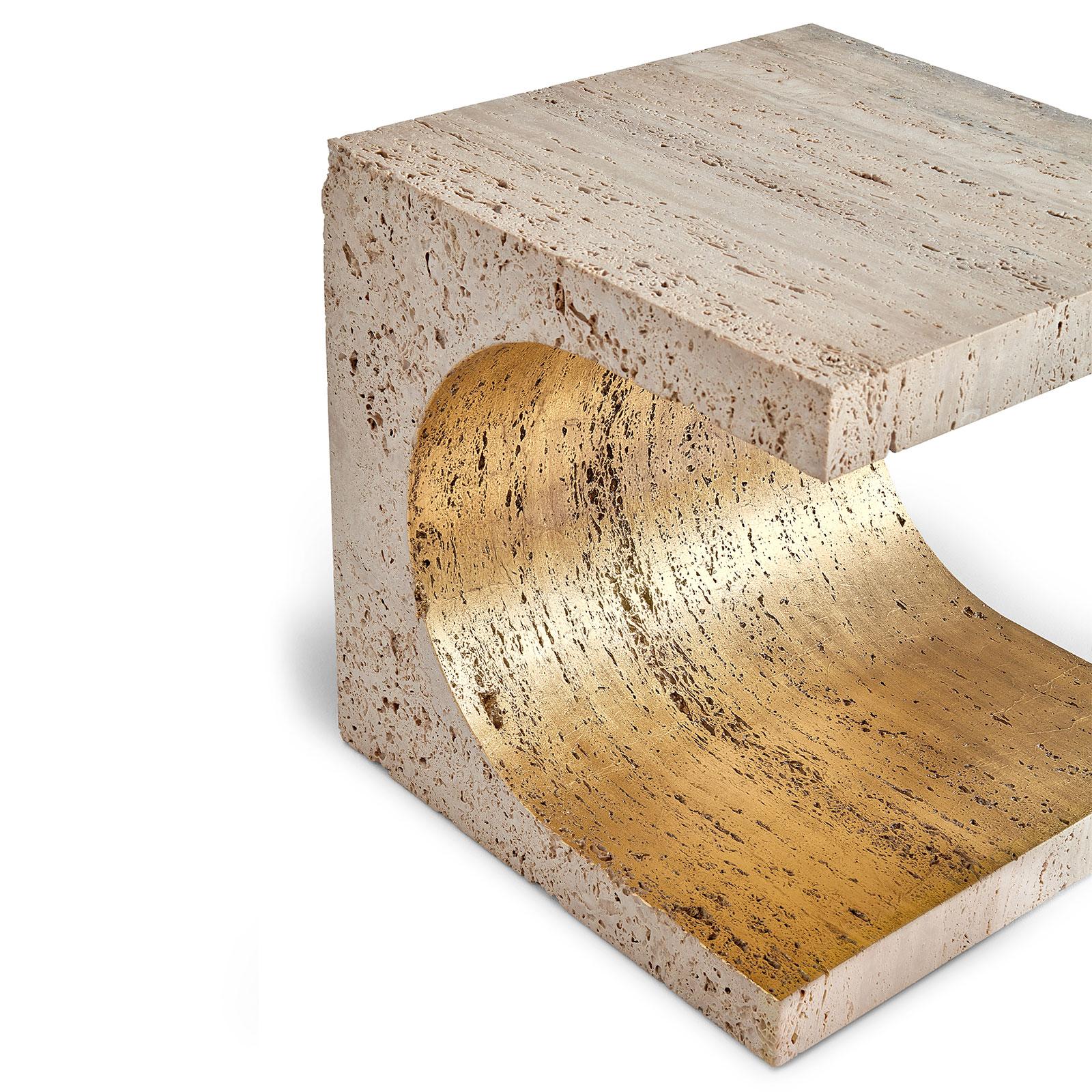 This side table is carved from a stone block, and the boundaries are either angular or curved. The porous texture of the Travertine breathes on the surface of the top and sides. And in its core, the gold leaf is hand gilded in the stone.
Body: