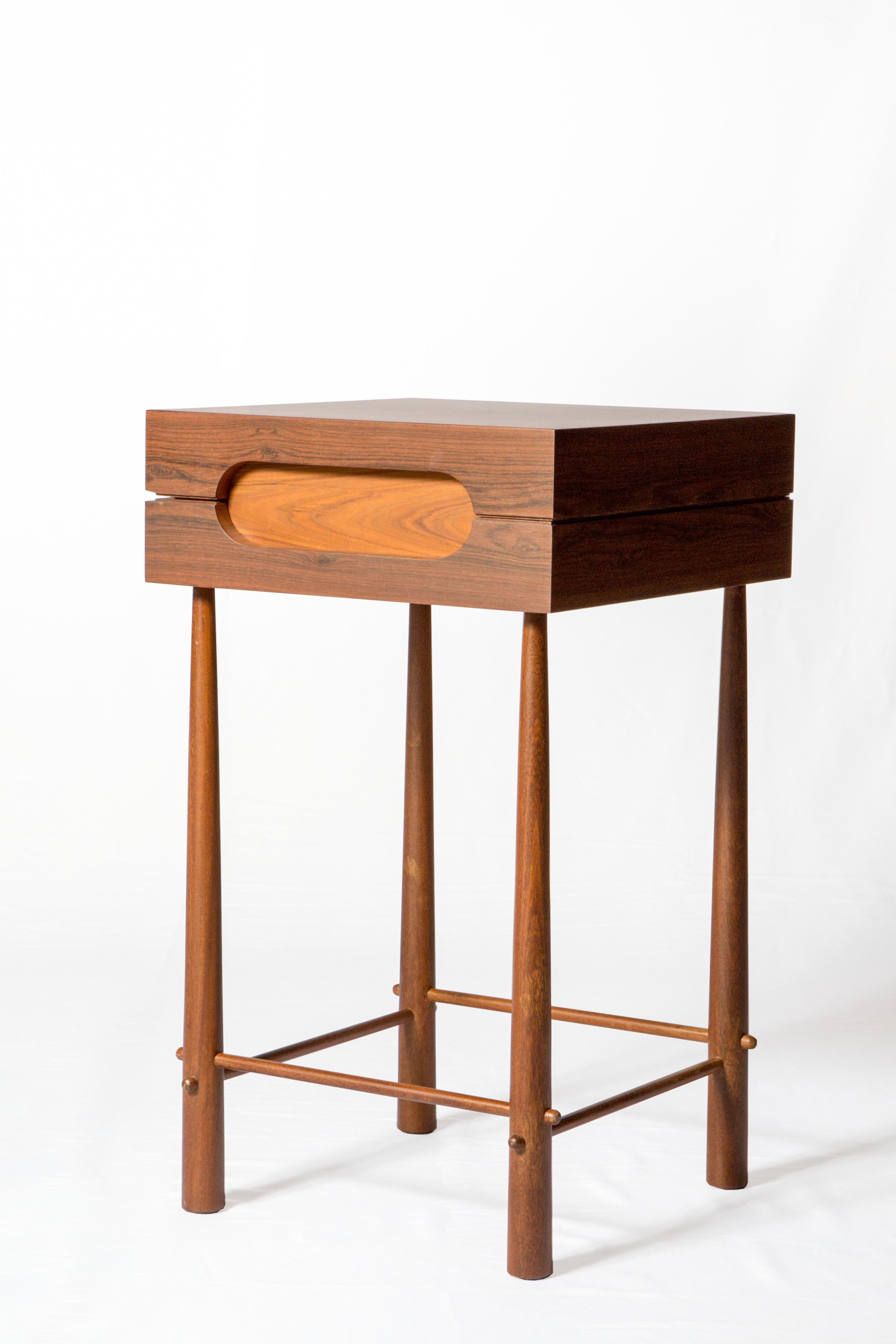 Small format high side table in Brazilian Ipê Wood and Louro Preto.
 