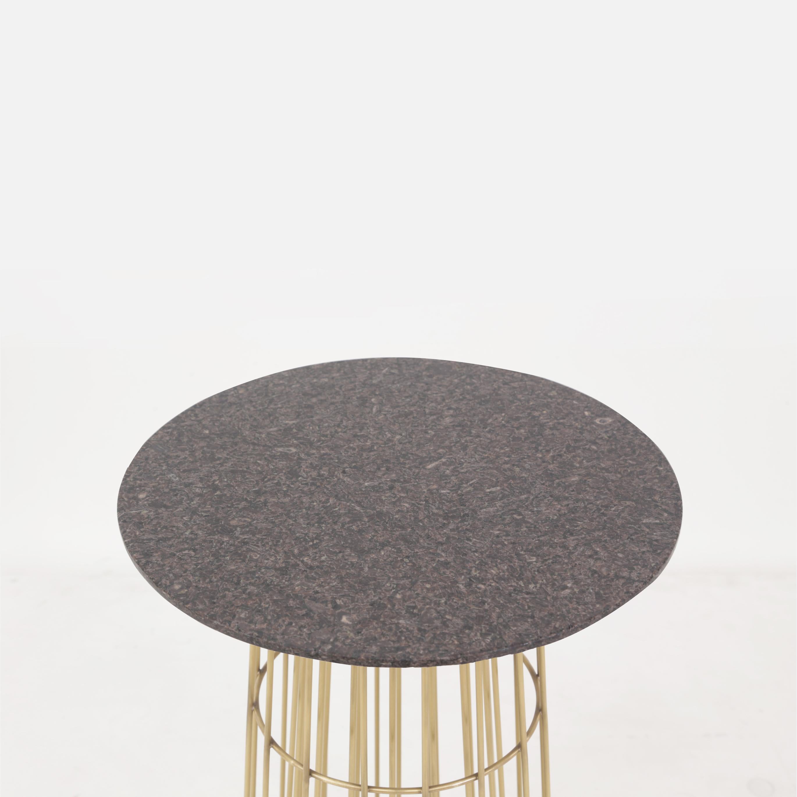 Contemporary delicate piece of art work in massive brass and Brazilian granite stone. The object was exposed in São Paulo and Paris, and was selected to appear in fashion and design review as Casa Vogue.
It can be used alone as a side table or