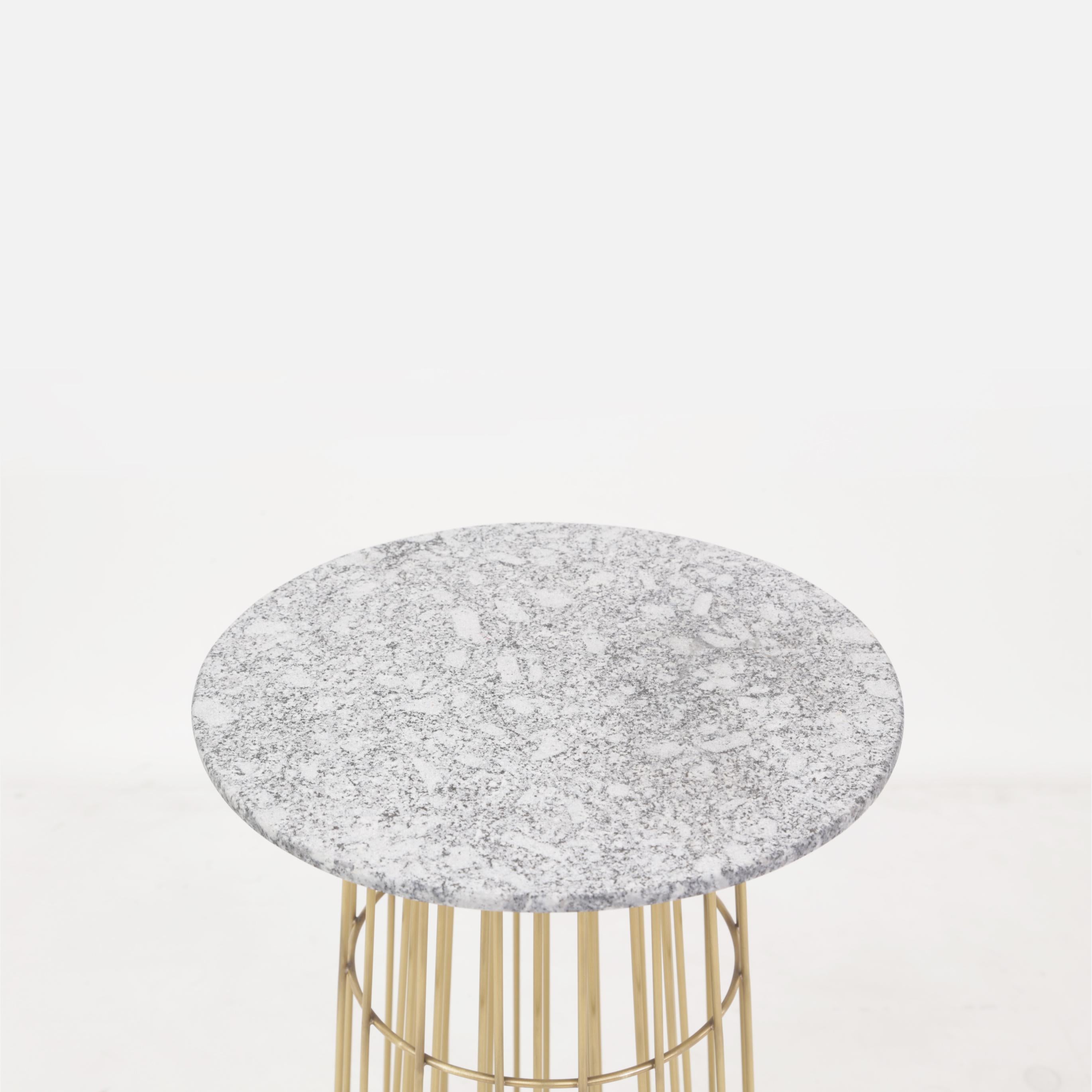 This contemporary delicate piece of art work in massive Brass and Brazilian granite Stone. The object was put on exposition in São Paulo and Paris, and was selected to appear in fashion and design review as Casa Vogue Brazil.

The table is made of