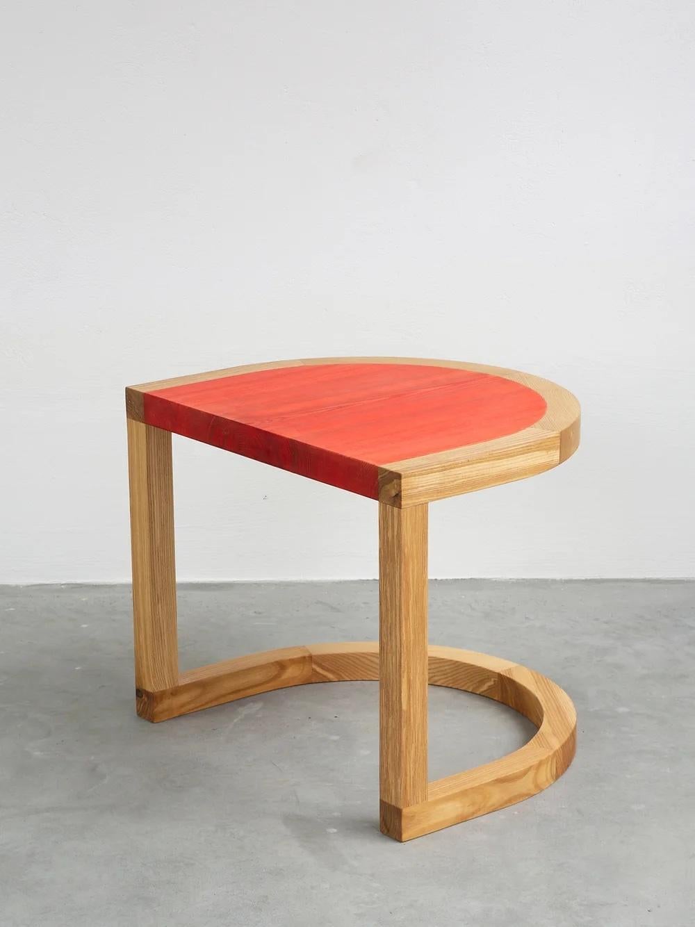 TRN Side Table
Model shown: TRN 1, Red and natural wood

Material: Ash wood, covered with a natural wax 
Care: Clean with a dry cloth, no water, no direct sunlight 

Dimensions: 
H: 45 cm (17,7