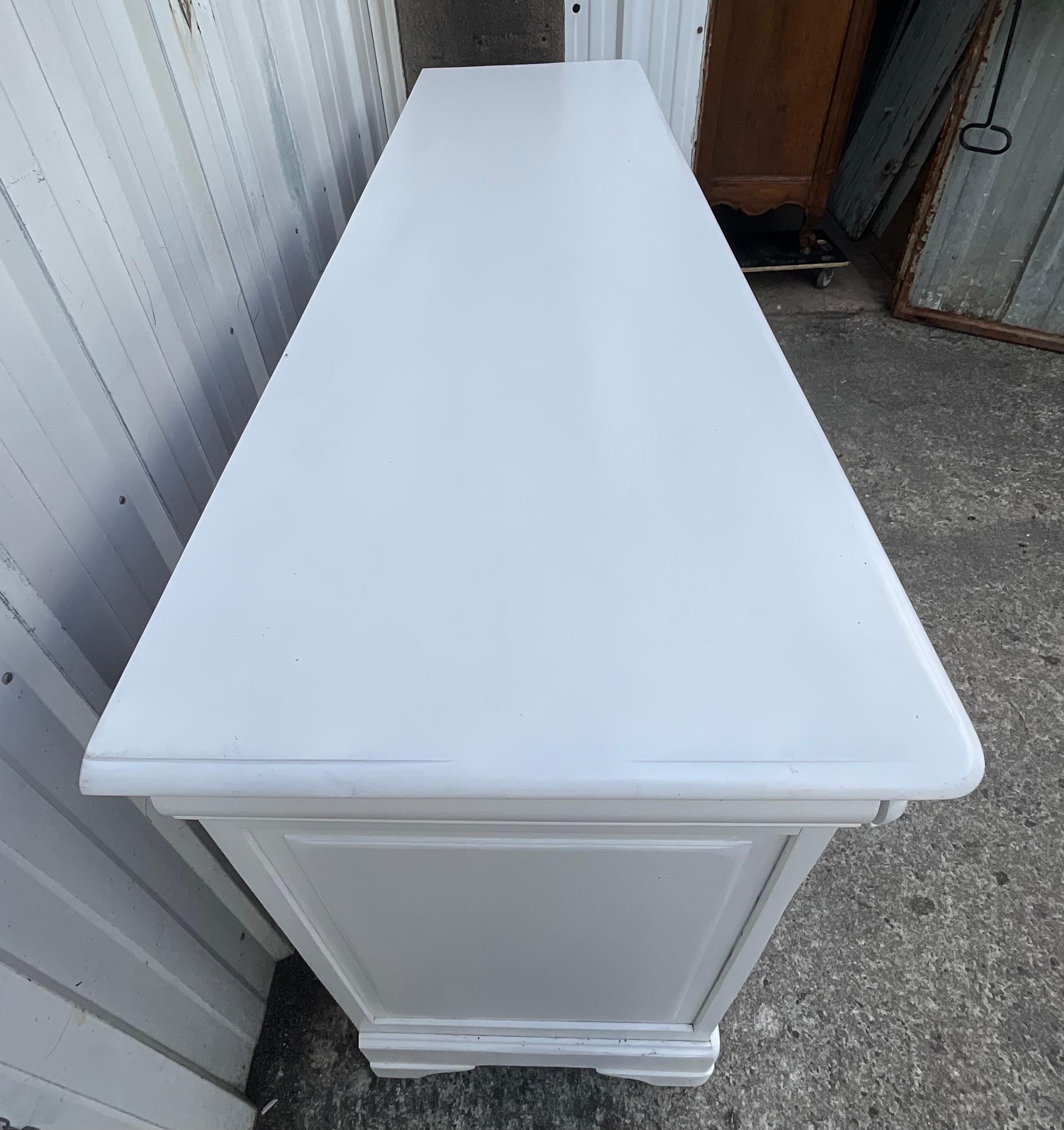 French enfilade in contemporary solid cherry 

This furniture opens with three doors and three drawers. 

The drawers are called “à doucine” and can be used to store sets of cutlery. They are mounted in a dovetail ensuring perfect strength. This is