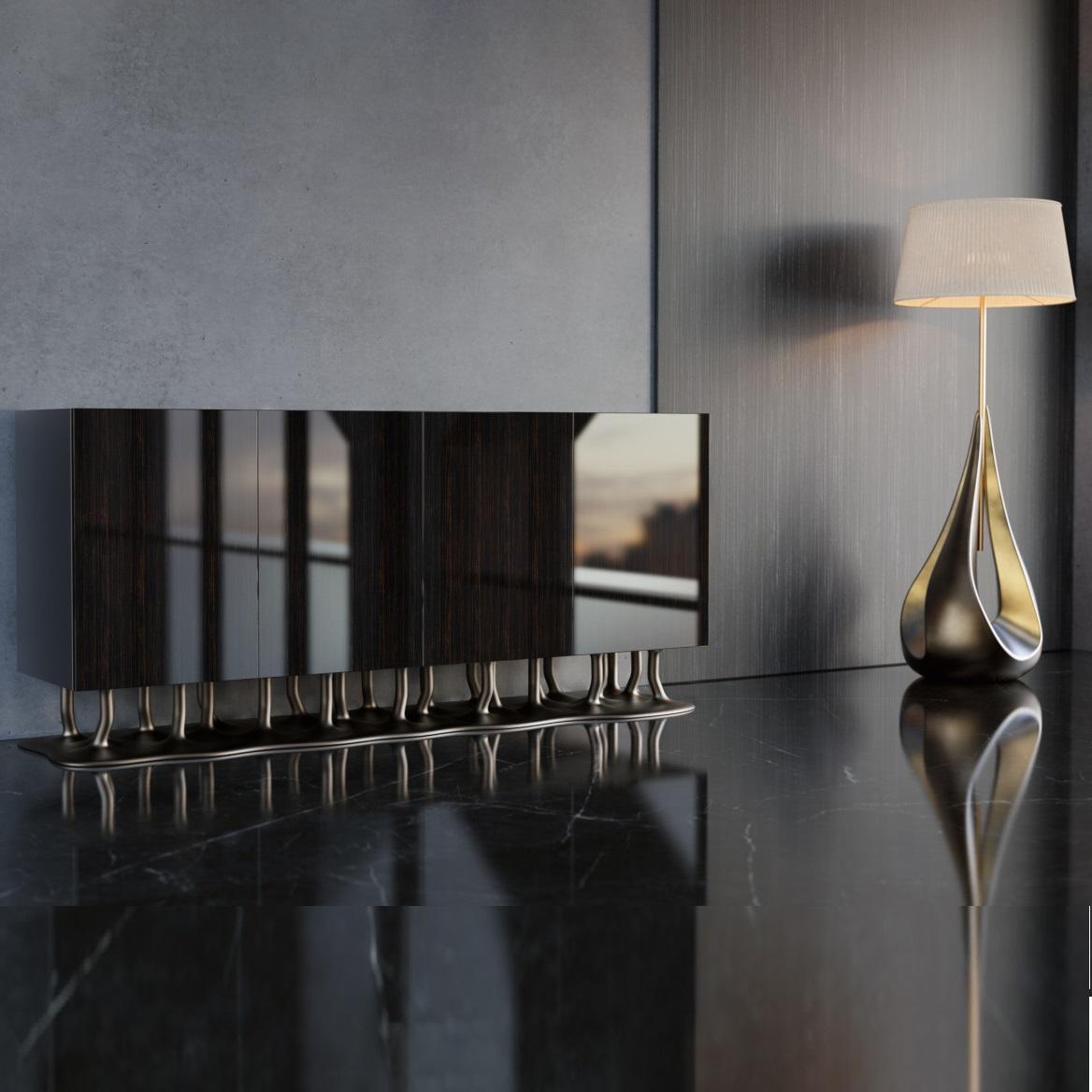 This sideboard has a special base that looks like tree roots, showing off a design inspired by nature. The doors are made of rich and luxurious ebony veneer, adding a bit of luxury and creating a bold contrast with the base. This Sideboard has roomy