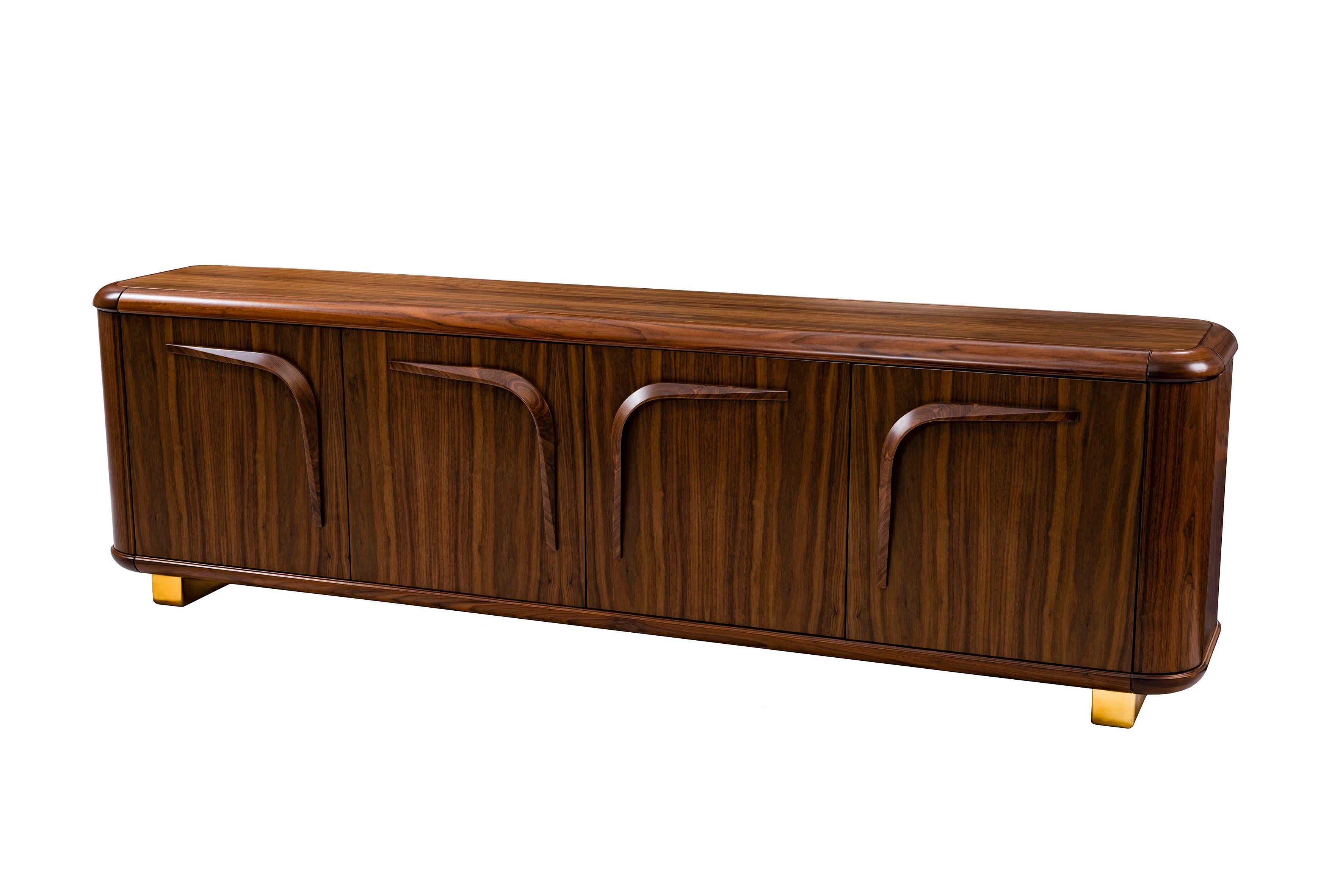 Contemporary sideboard wood by Cyril Rumpler, Dinner Box. The Sideboard is made in solid walnut and walnut veneer, brass legs, glossy finish. Entirely made of walnut or oak. 
The elegant base reflects the curved design of the furniture and ensures